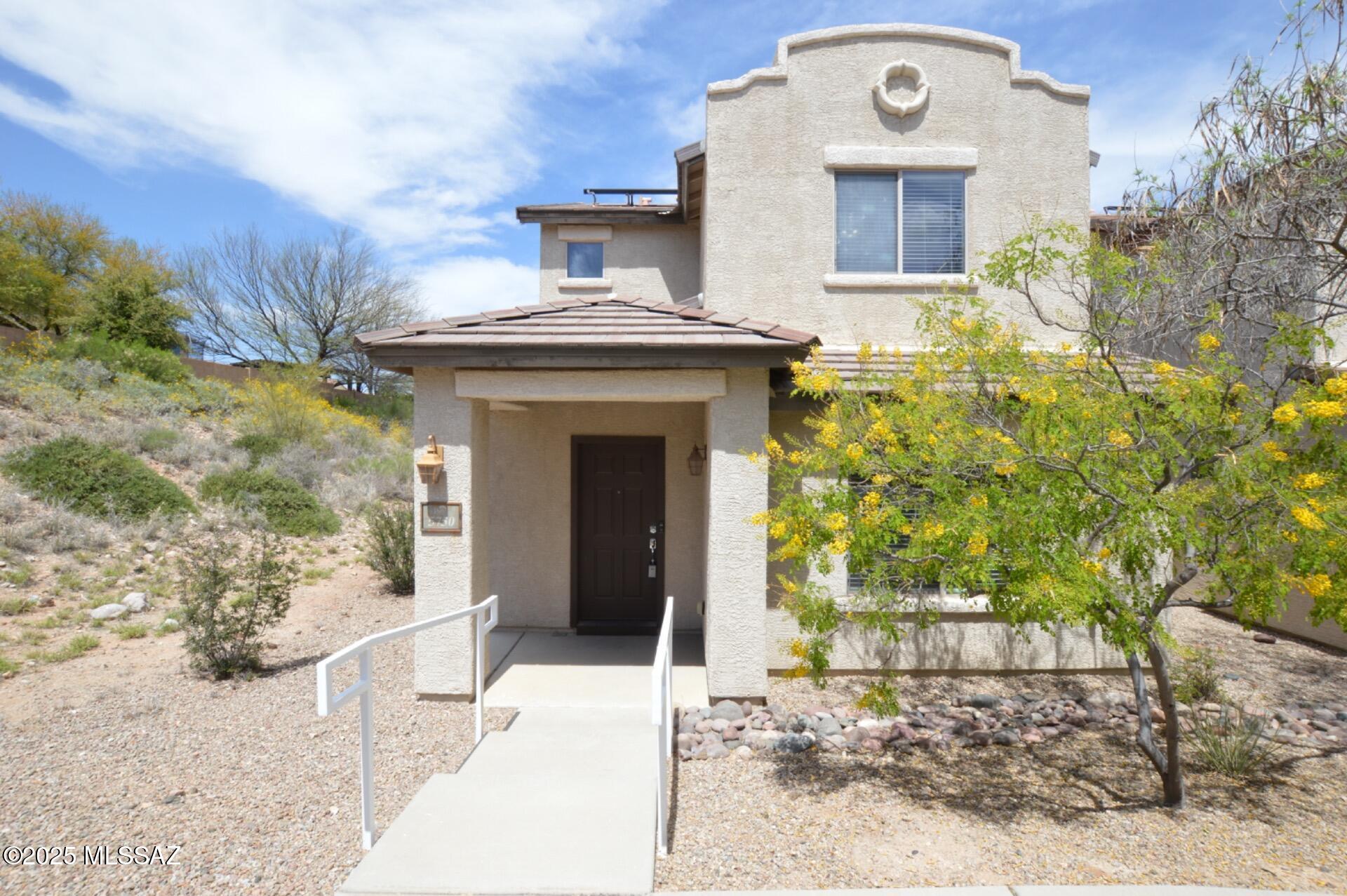 Welcome home to 1,356 sq ft of stylish living in the sought-after Sierra Morado community in Tucson! This thoughtfully designed 2-story home features a bright and open layout perfect for both relaxing and entertaining.
Enjoy a spacious great room entry that flows into a welcoming eat-in kitchen, complete with all appliances, an expansive breakfast bar, and plenty of counter space. The open-concept kitchen connects seamlessly to the living and dining areas—perfect for hosting family and friends.
Upstairs, you'll find two generously sized bedrooms, each offering ample closet space and privacy. The primary suite features a full bathroom for your comfort. Additional highlights include wood-look flooring in all the right places, ceiling fans, blinds throughout, and a 2-car garage. Located on a desirable corner lot, this home is part of a beautifully maintained community offering playgrounds, sports courts, scenic walking/biking trails, and breathtaking mountain views.