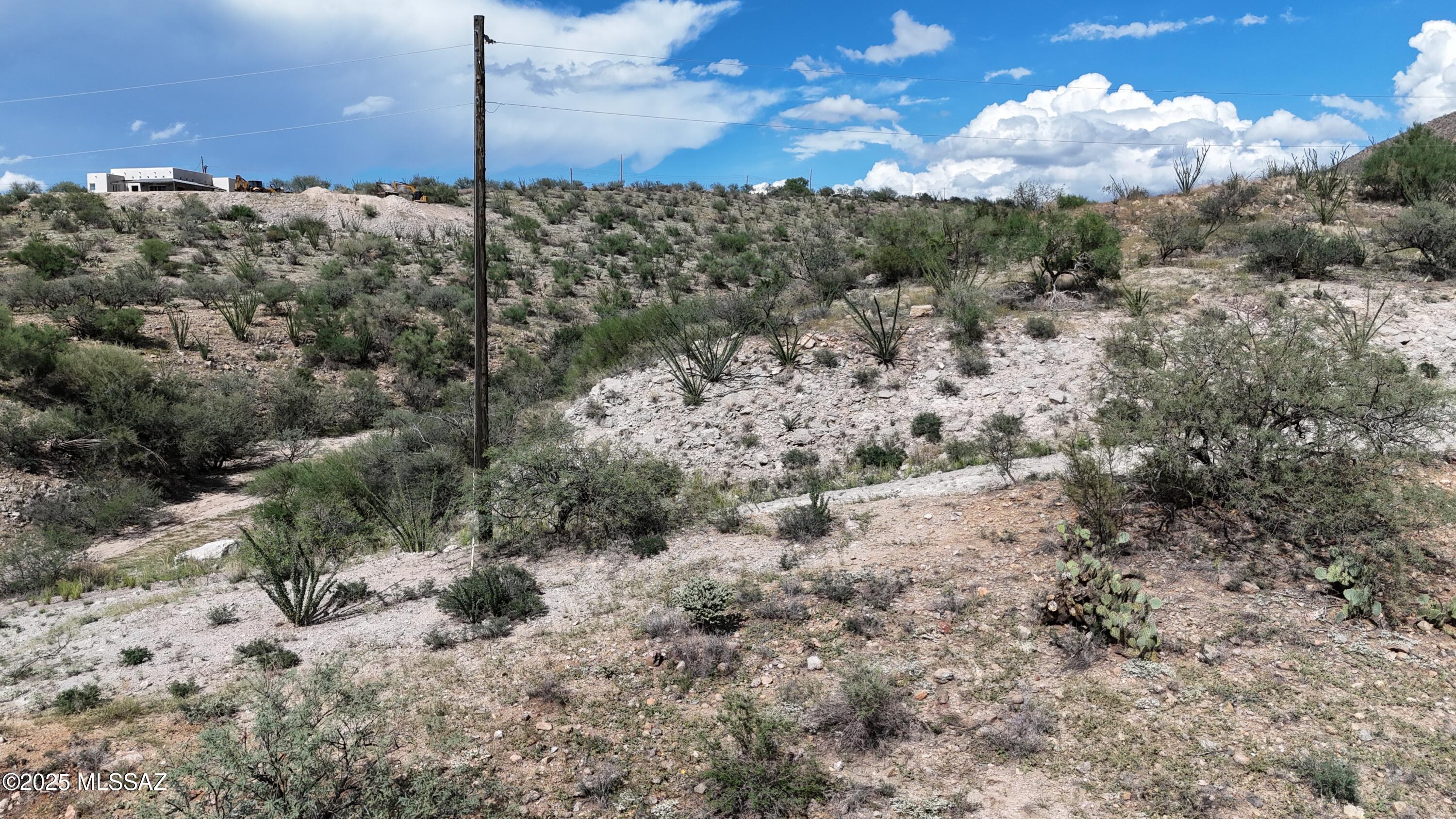 Triangle shaped lot with a wash that runs along the Northern boundary.  Great up close mountain views.