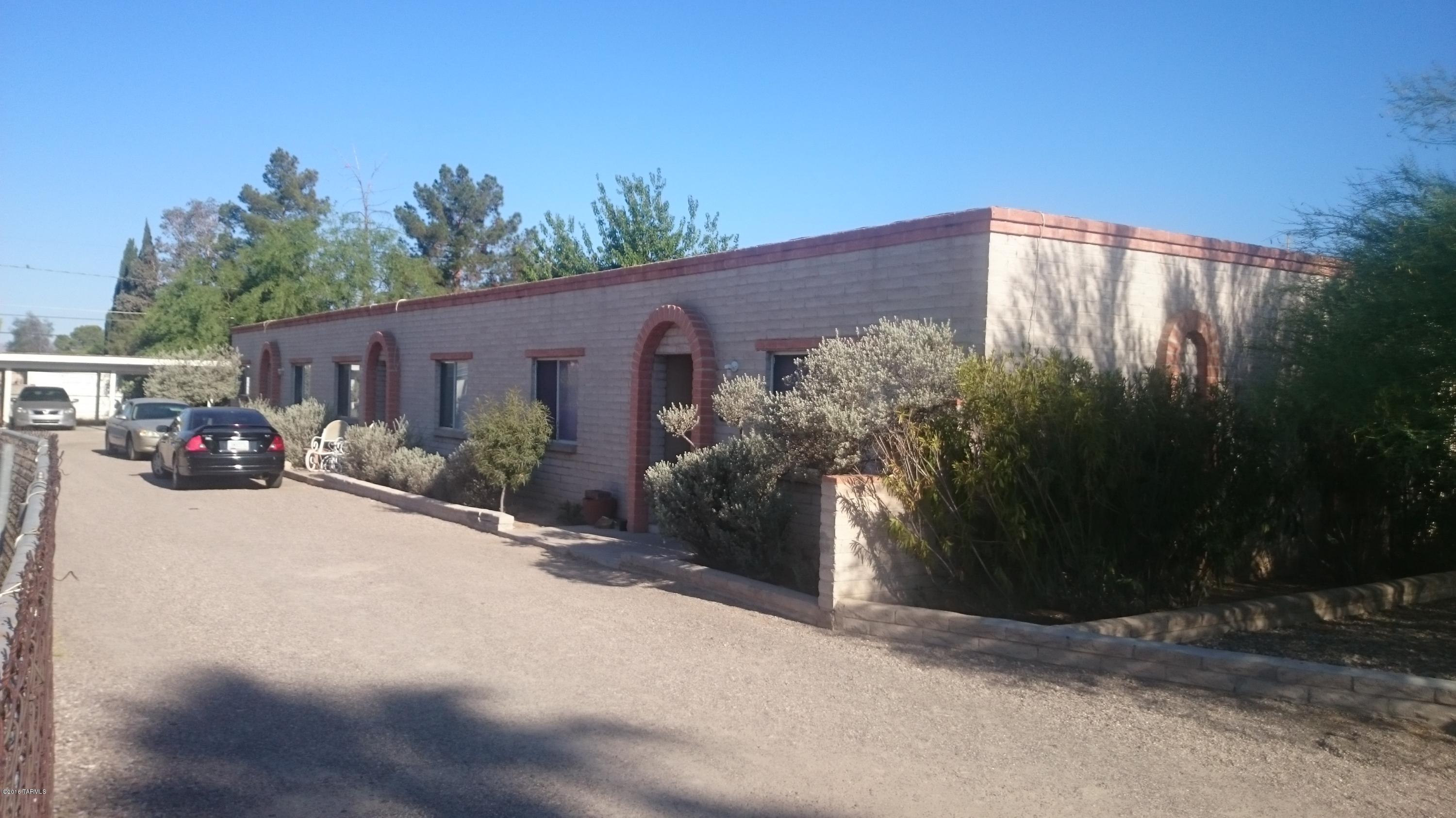 Three two bedroom one bath units,  AC and covered parking.