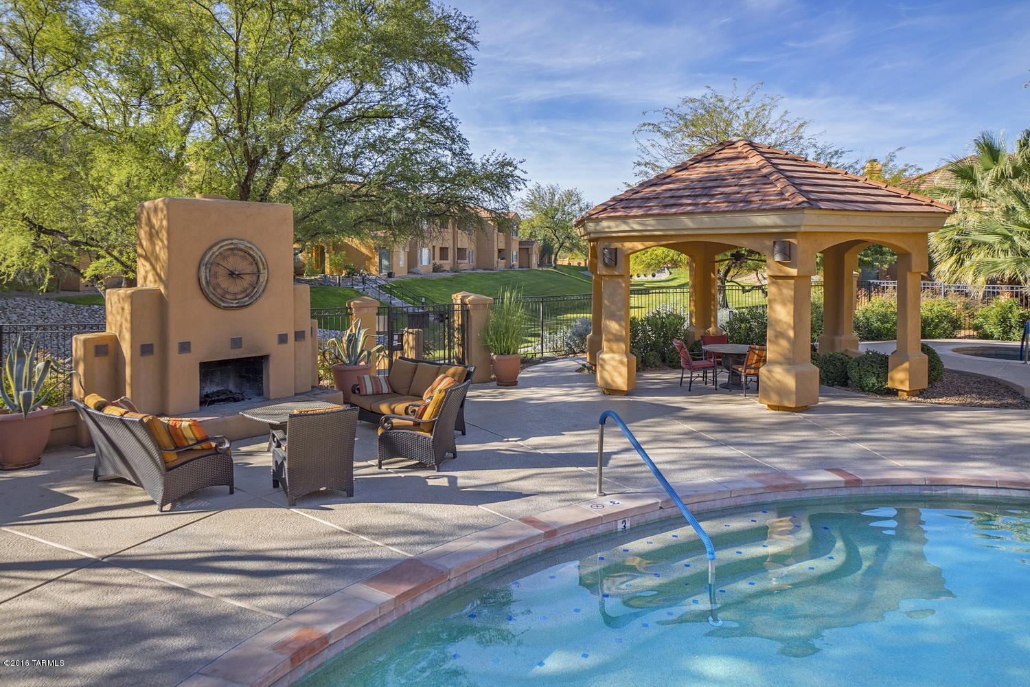 Private ground floor condo with amazing mountain views in the gated Catalina Foothills community of Pinnacle Canyon.  This remodeled Northern Tucson condo features an open floor plan with covered patio overlooking a community wash, master suite with walk-in closet, ceiling with crown molding, washer/dryer in unit and sidewalk ends just past the condo.  The Pinnacle Canyon Condominiums resort style amenities include an enormous heated pebble tec pool, clubhouse, exercise facility, bbq areas, park-like grounds and a convenient location across the street from shopping, numerous restaurants and near Sabino Canyon Park.