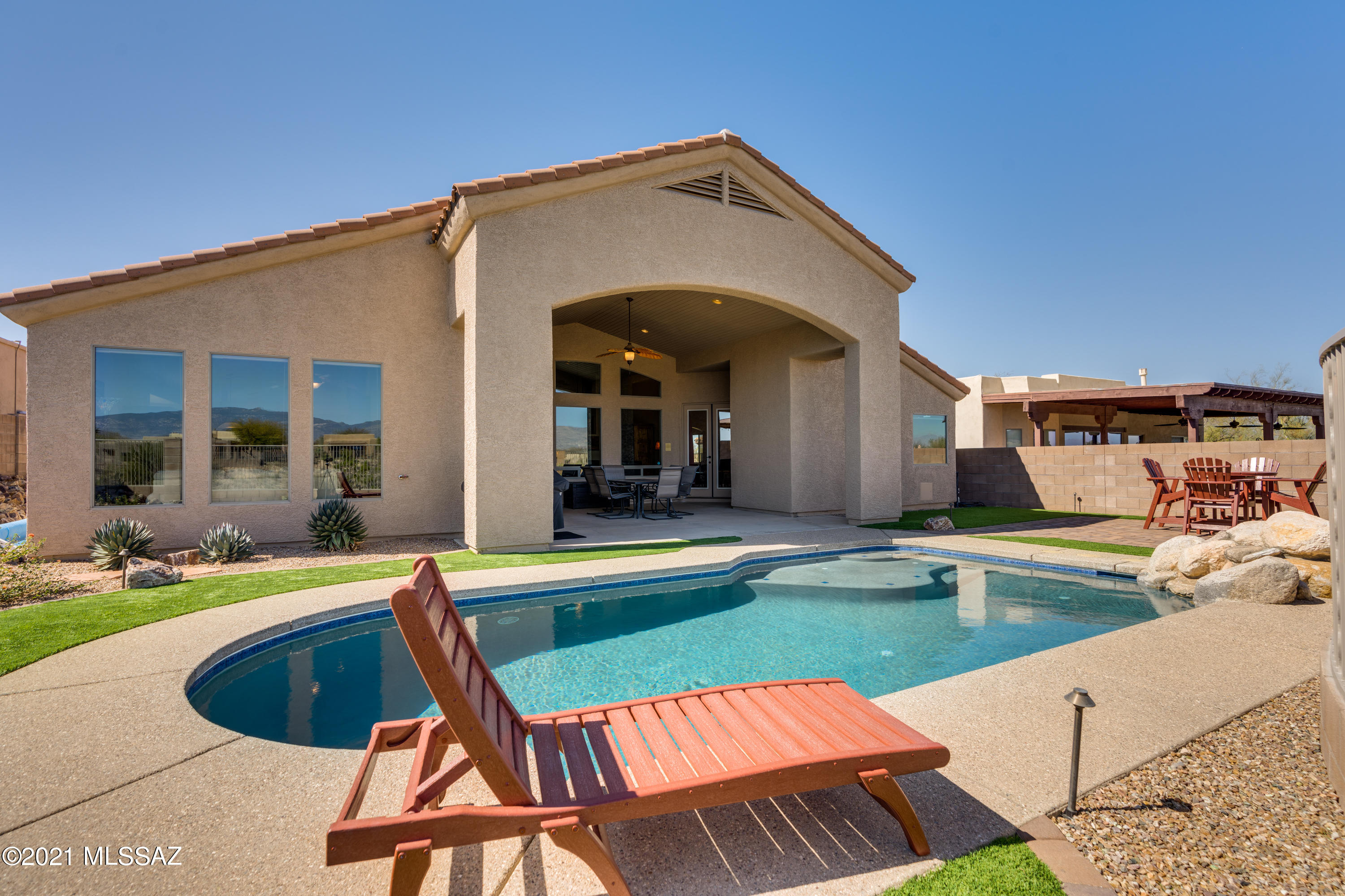 If ''home'' means your private oasis overlooking the 17th Fairway of Del Lago, panoramic Mountain Views & a recently updated beautiful home with a saltwater pool, then LOOK NO FURTHER! This home shows pride of ownership! So many upgrades. This beautiful former TAR Tour Winner + former Pepper Viner Model is located in the top-rated Vail School District. 3 bedroom + office / Den or 4th bdrm. Large kitchen with cherry cabinets (some glass front),  new granite counter tops and tiled backsplash, Island with bar seating.  New refrigerator, gas cooktop, microwave & dishware (bosch). Soaring ceilings, huge windows with beautiful views, ceramic tile floors, gas fireplace, designer ceiling fans. Master retreat features a huge walk-in closet, garden tub & separate shower. Large covered outdoor livin space overlooking your tranquil saltwater pool and waterfall. Gas ready for an outdoor grill. Enjoy the new front paver patio & entry that creates a truly grand entrance. New water heater with recirculation on timer. New Synthetic glass pool filter, pool pump & salt generator. New water softener. New main water lines from street to home. New water softener. You will want to make this rare find in the gated WingView community your new HOME!