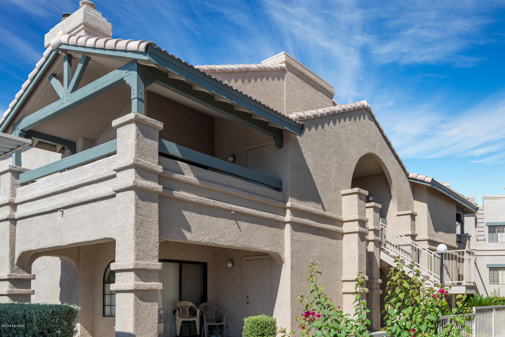 Beautiful Starr Pass condo complex with all the resort amenities.  Top floor unit for extra privacy and noise control, vaulted ceilings, mountain views situated at the back of the complex.  This unit has new paint, carpet and has been pre-inspected.  Two large bedrooms with spacious bathroom, wood burning fireplace, granite counter tops and new appliances.  This really is move-in ready!  The complex offers pool, spa, clubhouse, tennis, covered parking, hiking trails nearby, and usage of the Starr Pass golf club.  Close to busy downtown, University of Arizona and Pima Campus.  Excellent rental, downsize home or winter getaway.  HOA covers: roof, exterior maintenance, landscaping, amenities and water/trash/sewer.