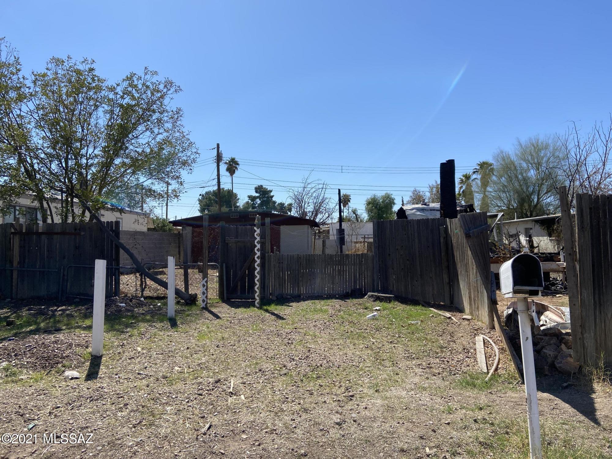 Mobile Home Lot with 8x8x16, 610 sq-ft block building with utilities and plumbing. New 200 amp electrical post and a 6 ft masonry east wall. Sold As-Is. Cash Only.