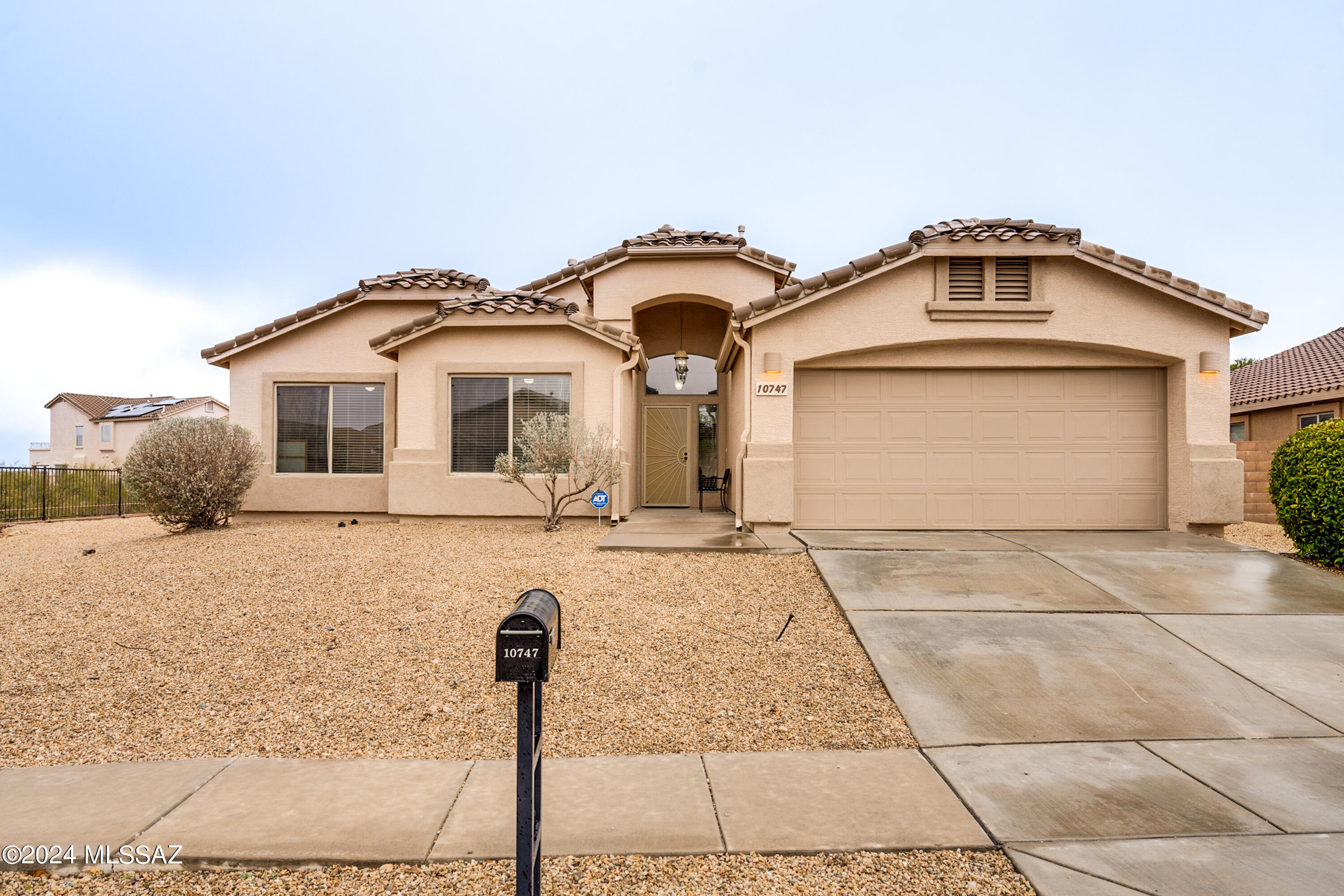 This stunning 3 bedroom, 2 bath home boasts 1862 square feet of luxury living space. As you step inside, you're greeted by an open floor plan adorned with cathedral ceilings, arches, and an abundance of windows that flood the space with natural light. The inviting family room features a cozy fireplace, perfect for gatherings, and French doors that lead to the patio, seamlessly blending indoor and outdoor living. The eat-in kitchen is a chef's delight, featuring granite countertops, a large breakfast bar island, stainless steel appliances, a gas range, and a water filtration system. Retreat to the spacious master suite, complete with a beautifully remodeled bathroom boasting dual vanities, a luxurious step-in shower with a built-in bench, and an amazing massage shower head system. Plus, enjoy direct access to the backyard. Outside, entertain or unwind under the covered patio, overlooking the large corner lot just waiting to be transformed into your personal oasis. Located in The Award-Winning Vail School District.