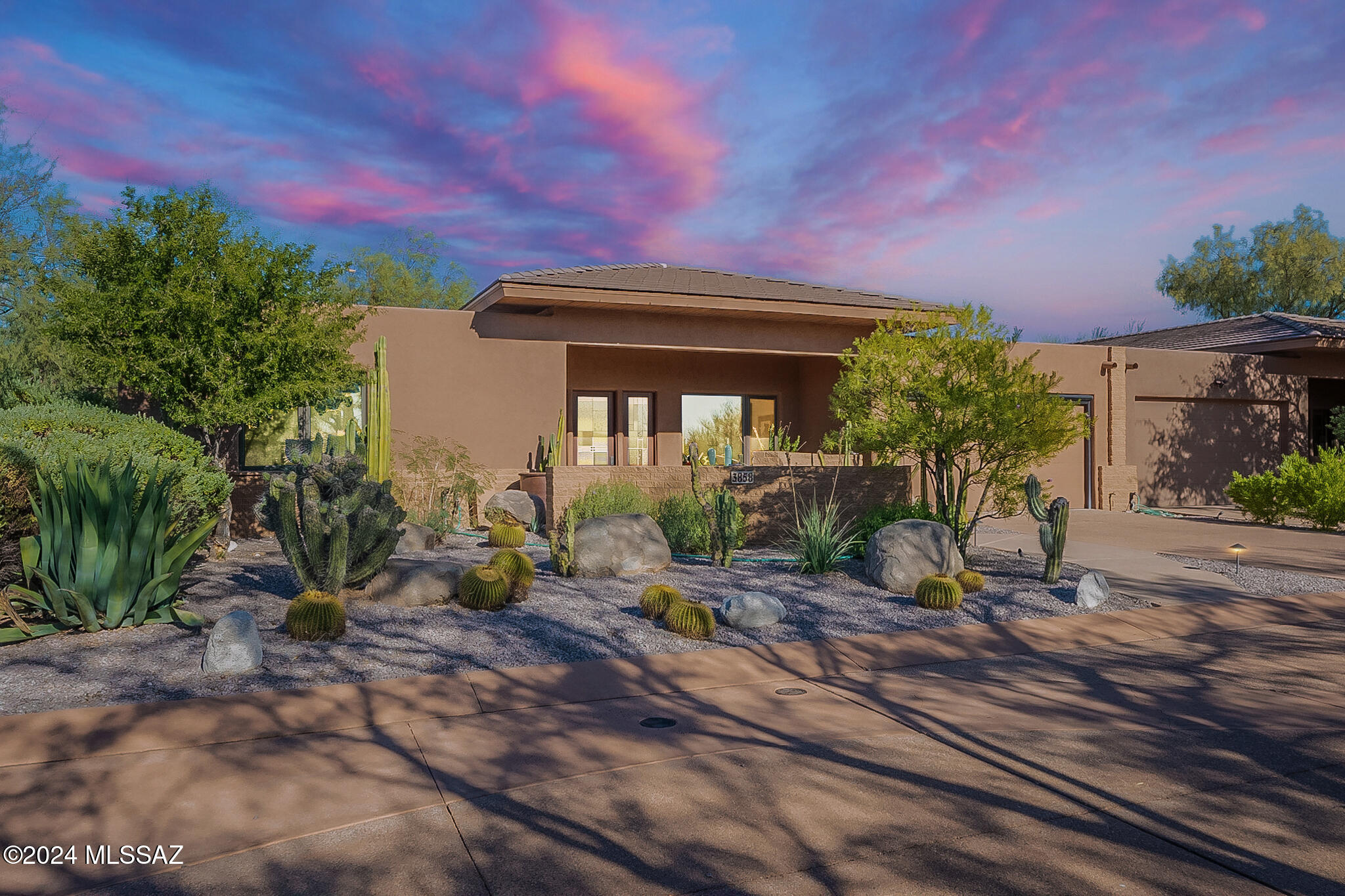 Fabulous turn-key home in world class Canyon Ranch! Imagine a lifestyle that truly exceeds anything else in Tucson that includes membership to this esteemed and storied property. Fully furnished and ready for its new owner! This 2bed/2bath home really has all the luxury you would expect. With an open concept great room with coffered ceilings to massive Pella glass windows, travertine floors, front and back patios, hand made fireplace and water feature, lovely planters and superb desert fauna and flora abound! Mountain and sunrise views await you as well. Kitchen is warm and inviting with cherry cabinets, honed slate counters and top end appliances. Bedrooms and baths are exquisitely appointed with generous space, lovely views and natural light. Your dream home awaits!