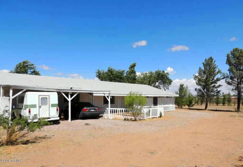 What a great value!  Single Family Home, 1,925 SF, private well, septic and on a private 1.14 AC lot.  The fence surrounding the property and all the trees provide that private, serene setting. Much of the updating & remodeling has been done.  Move-In-Ready! Get out of the city and enjoy the quiet life in the county.  The location is between the Dragoon Mountains to the west and the Chiricahua Mountains to the east. Be sure to click on the virtual tour for more pictures and info.  The Chiricahua Mountains are a mountain range in Southeastern Arizona and part of the Coronado National Forest. The highest point, Chiricahua Peak, has an altitude of 9,750 feet.