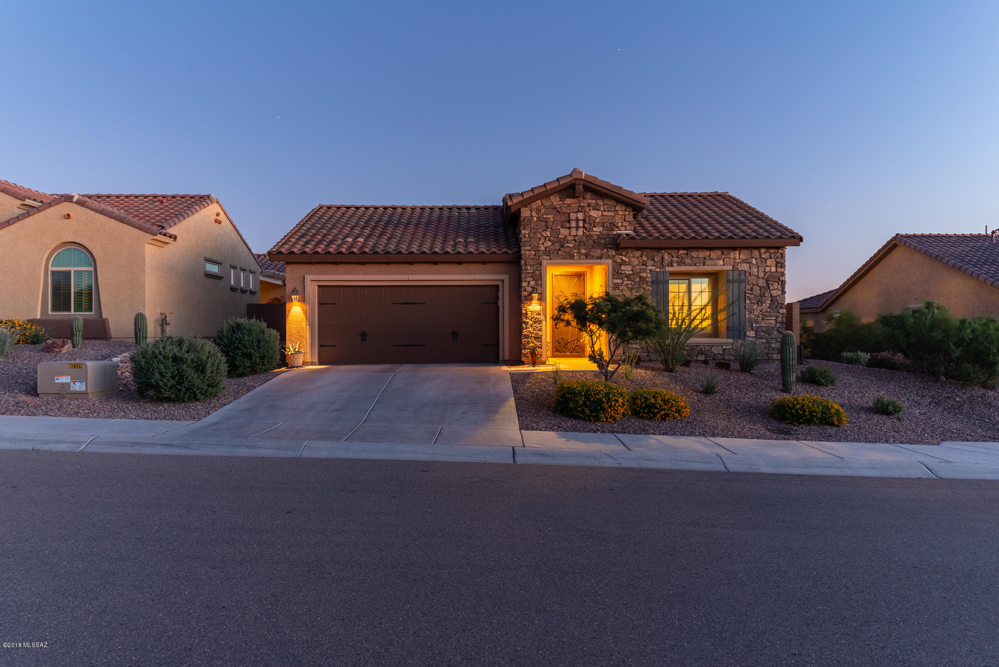 Owner is a licensed Arizona real estate agent. Surrounded by desert beauty, golf courses minutes away & hiking trails galore. Pack your bags this beautiful, contemporary, Haven model is move-in ready. Home features split floor plan w/private paved courtyard patio. Spacious master suite w/bay windows & custom shutters throughout. Master bath boasts a double sink vanity w/garden tub & shower w/bench seat. Large walk-in closet offers plenty of storage. Chef's kitchen complete w/built-in oven, granite countertops, tile backsplash, pullout cabinets & stainless steel appliances. Gorgeous outdoor living space, covered patio & pavers. View fence to take in awesome mountain views. Expanded 2 car garage w/custom storage cupboards & work area. Custom decorative front screen door & matching side gate. Gutters on patio/courtyard.