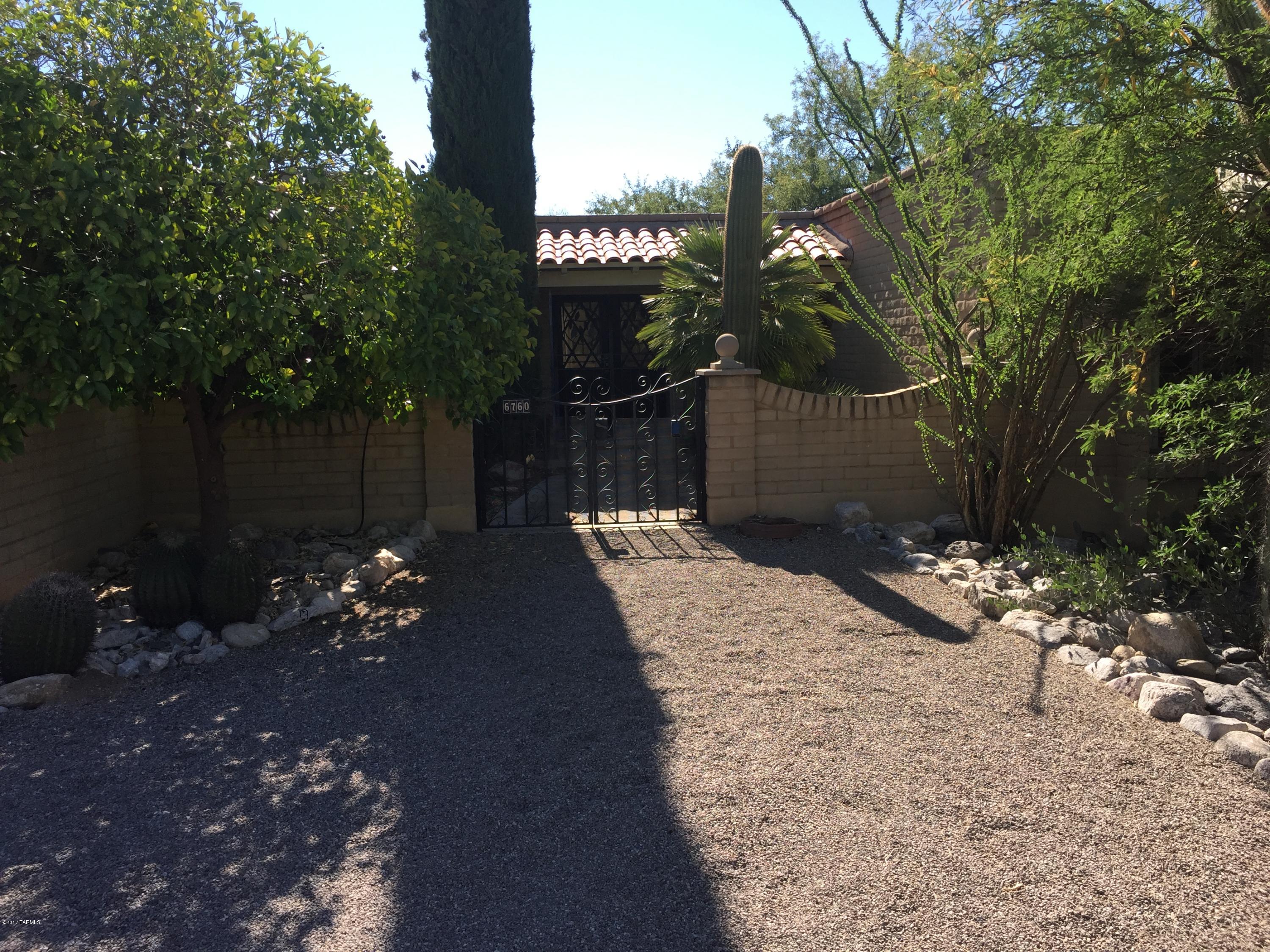 Great opportunity to live in sought-after Coronado Foothills.  Property features a large pool, great views of the Catalina's and over 20 mature saguaros and citrus trees!  Kitchen has two large sliding doors providing great access to covered patio and BBQ area.