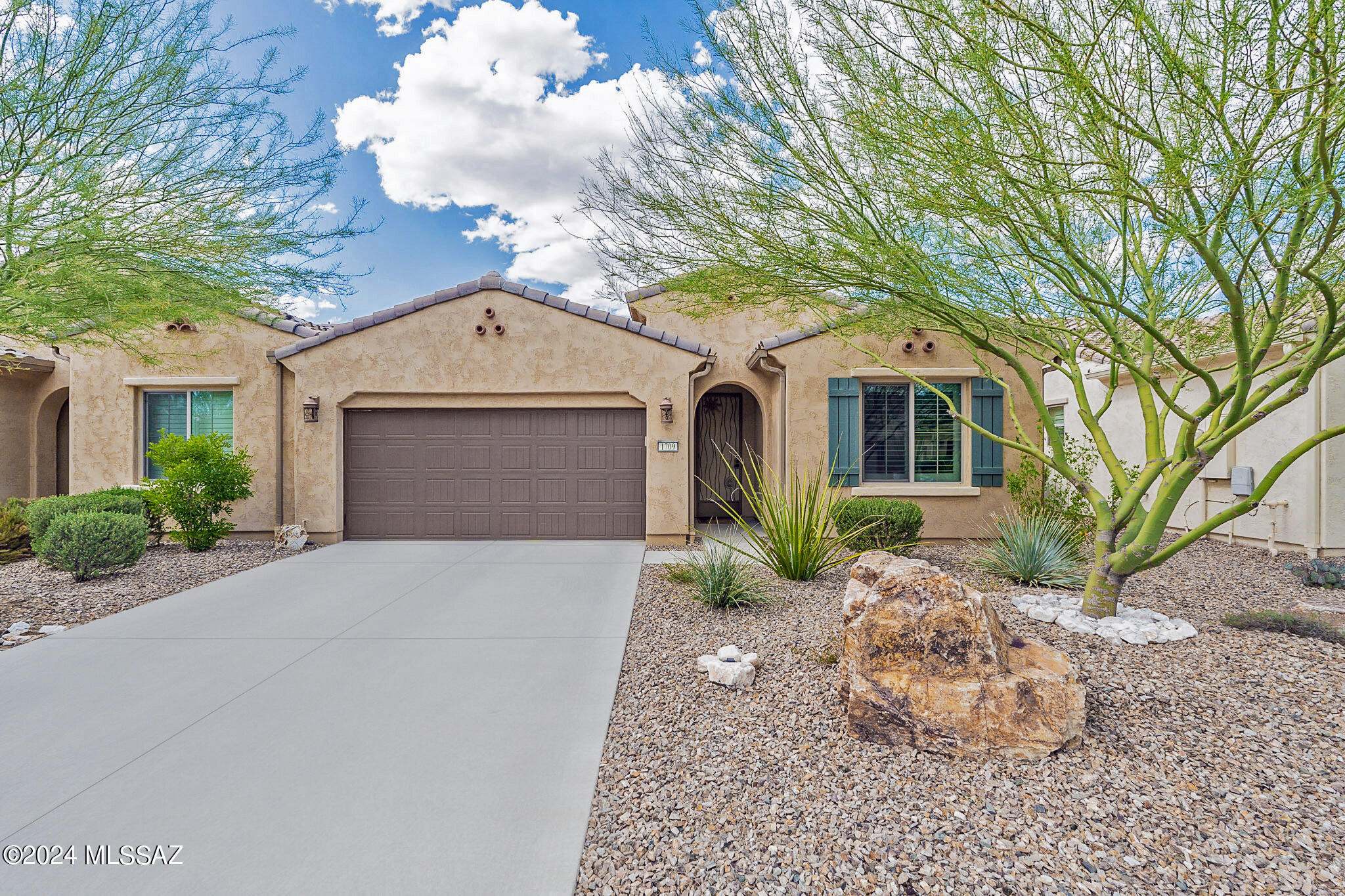 Looking for a full-time home, ''lock and leave'' residence or investment property? This gently occupied Courtyard Villa will not disappoint! Built 2019, this Primrose model has 1,447 sq.ft., with 2 BR, 2 BA and Den. Interior finishes incl. neutral color palette, deco tile foyer, plantation shutters, upgraded fans and lighting, cook's kitchen w/ breakfast bar, pendant lighting, quartz counters, tile backsplash, SS appliances, gas range, composite sink, 41'' upper cabinets w/ UC lighting, pantry closet. Open floor plan w/ space for living and dining; den off foyer. Owner's suite w/ dual vanity bath, tile shower, walk-in closet. Covered patio w/ private rear paver courtyard for pet safety, artificial turf / putting green; backs to large common area w/ plenty of trees and shrubs for privacy. The Villas HOA covers hazard insurance, exterior paint, roof and window maintenance, front and rear landscaping, and landscaping and maintenance of common areas within the Villas. Come enjoy resort living at Quail Creek, a gated, active adult community offering a wide variety of centrally located resort-inspired amenities including: three 9-hole championship golf courses, a driving range, putting green and pro shop. Plus, 32 pickleball courts, swimming pools, fitness center, arts and technology center, tennis and bocce courts, restaurant and bar, clubhouse with coffee bar, library, billiards, ballroom, conference center, dog park, and dozens of social clubs and activities. The new Quail Creek Canyon Club opening soon will add additional pools, fitness center, bistro and more.