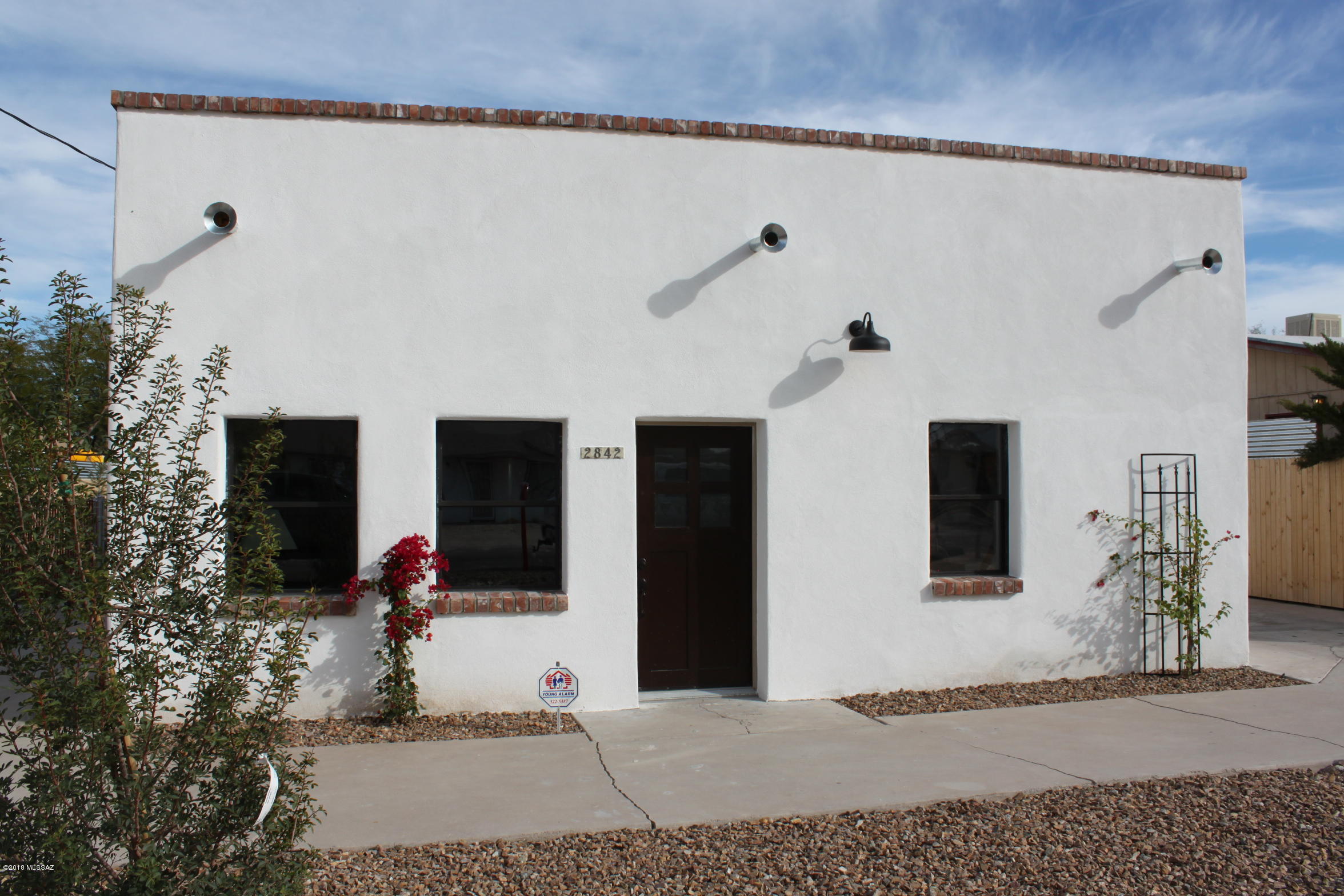 Fully renovated enchanting home located in the Fort Lowell historic district just minutes from Tucson Medical Center and the Loop Bike Path. This home is like no other and no detail or expense was spared on this complete renovation. Home features new Trane AC/Heating system, new water heater, new electrical, new roof, new plumbing; this is essentially a new construction property. The home boasts 3 bedrooms and 2 baths. From the moment you walk through the door the attention to all the details is evident. The kitchen has quartz counters with a stainless gas stove and pot filler. The master suite is spacious with a walk in custom closet with chandelier and the master bath has dual sinks with marble counters. This is a must see home and it will not last long! Huge lot for an in town property.