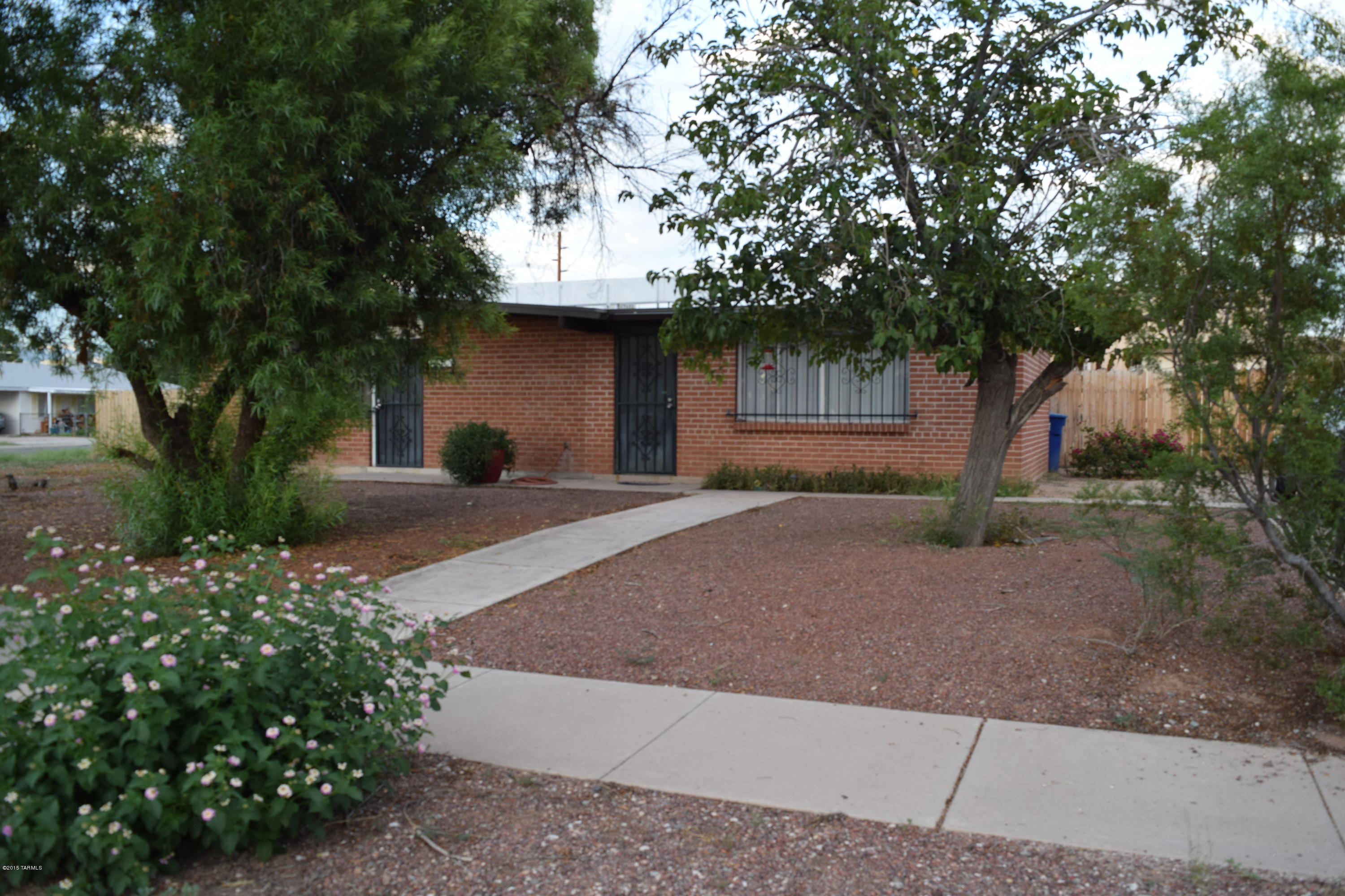 Completely remodeled 1504sf 3bd/2ba house on 12,000+sf corner lot close to shopping and Davis Monthan with dual-cooling and large back yard. Updates include new carpet, new doors, new windows in the bedrooms, new tile/vanities/toilets in the bathrooms, newer kitchen cabinets, washer/dryer, and designer 2-tone paint throughout. Also includes detached finished 200sf studio/office bonus building not included in square footage. Includes Work Shop, Upgraded laundry room and newer water heater. Huge backyard with mature vegetation including pomegranate, apricot, tangerine, citrus trees & more.