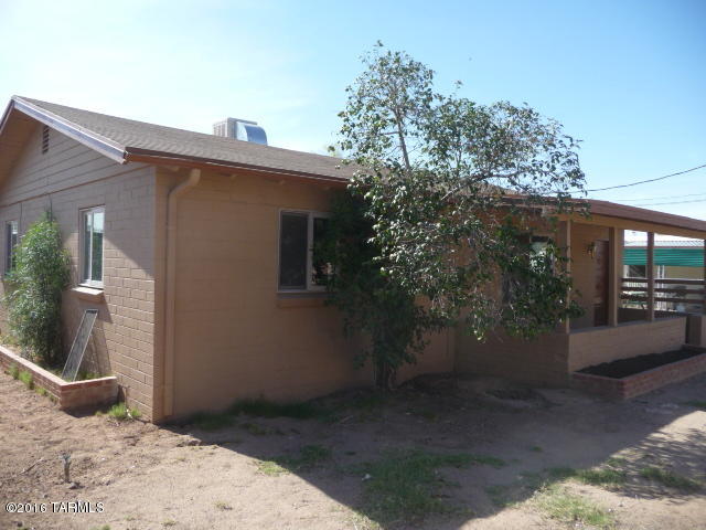 Great location for this starter home, within 2 miles of Tucson Mall, Auto Mall, medical facilities and University.  Completely fenced 2bd, 1ba 910 sq ft home built in 1953 on .11 acre lot.  Freshly painted inside and out, tile floors, has stove, refrig and washer and dryer.  Gated parking.  MU zoning.