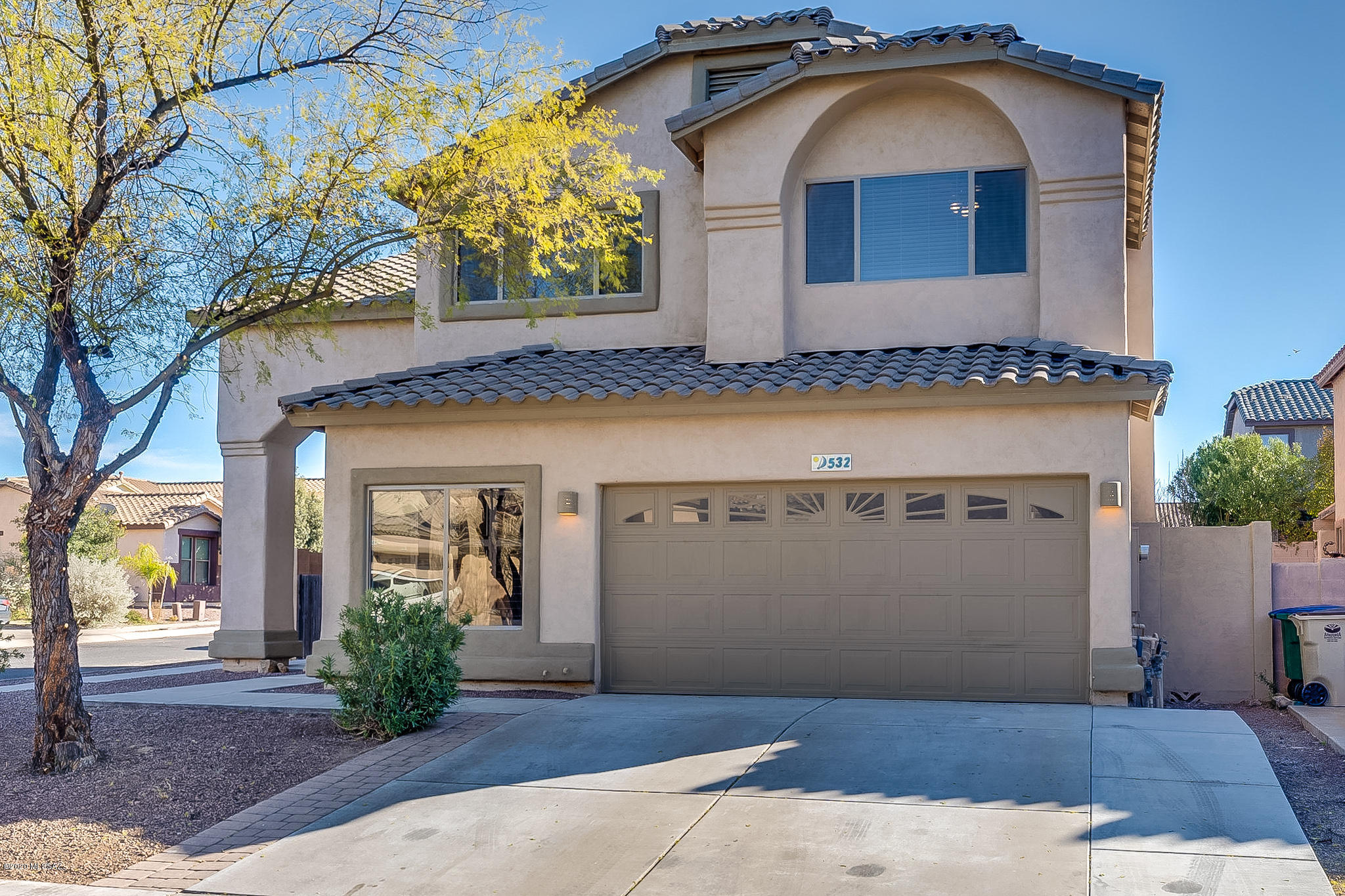 Tasteful remodel on corner lot in desirable Rancho Sahuarita!  This Townsend Kane charmer has had recent renovations including new AC, new flooring throughout, fresh paint, updated cabinets, granite counter tops, plantation shutters and stainless appliance package!  This spacious 2-story home sits a in gated neighborhood and has incredible mountain views with the roof top deck.  The covered patio lined with attractive brick pavers overlooks mature trees in backyard, built in BBQ and custom water feature!  The master suite is  magnificently sized with office nook and walk-in closet.  Your new home awaits you!