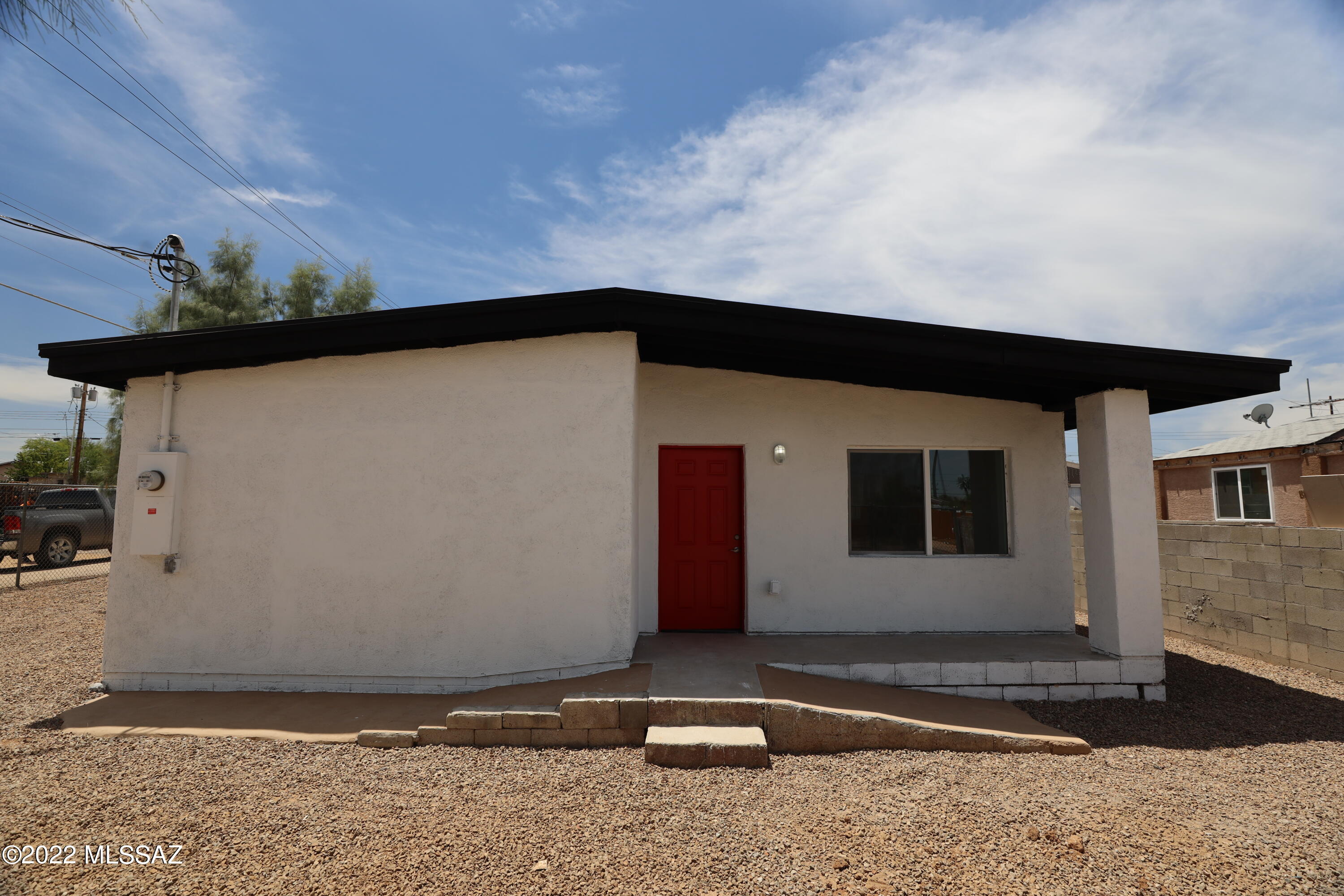 Completely remodeled 2bed 1 bath WITH permits.  Large corner lot completely fenced with two large gates for access.  New stucco, paint, electric panel on exterior.  New Kitchen, bathroom, concrete overlay floors, cabs, drywall, paint, insulation, fixtures and showers.