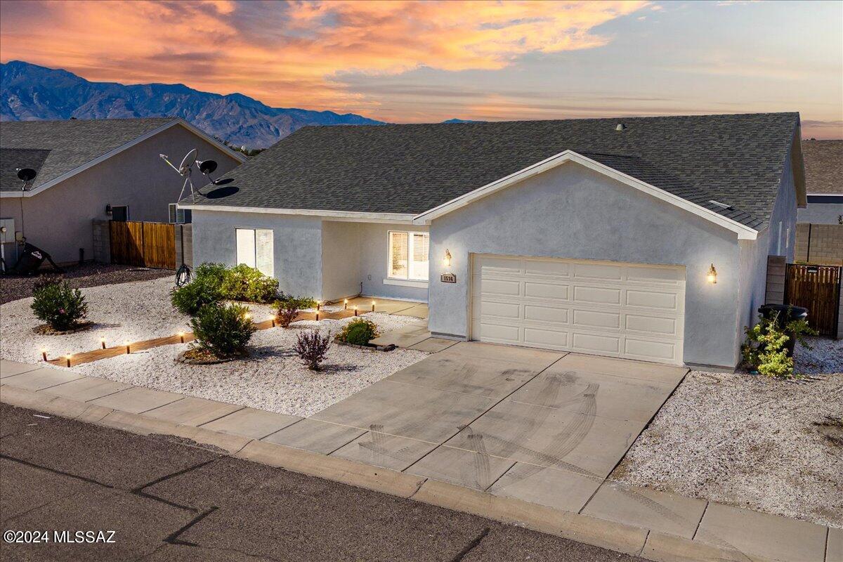 Welcome to your dream ranch-style home in Thatcher Cota Ranch! This charming 4-bedroom, 2-bath residence features a sleek all-white kitchen with stunning granite countertops, perfect for culinary enthusiasts. Enjoy the durability of LVP flooring throughout the living areas and carpet in the bedrooms. The spacious backyard is enclosed by a privacy block wall fence, offering a serene retreat, while the beautifully landscaped front yard enhances curb appeal. Don't miss out on this inviting home!