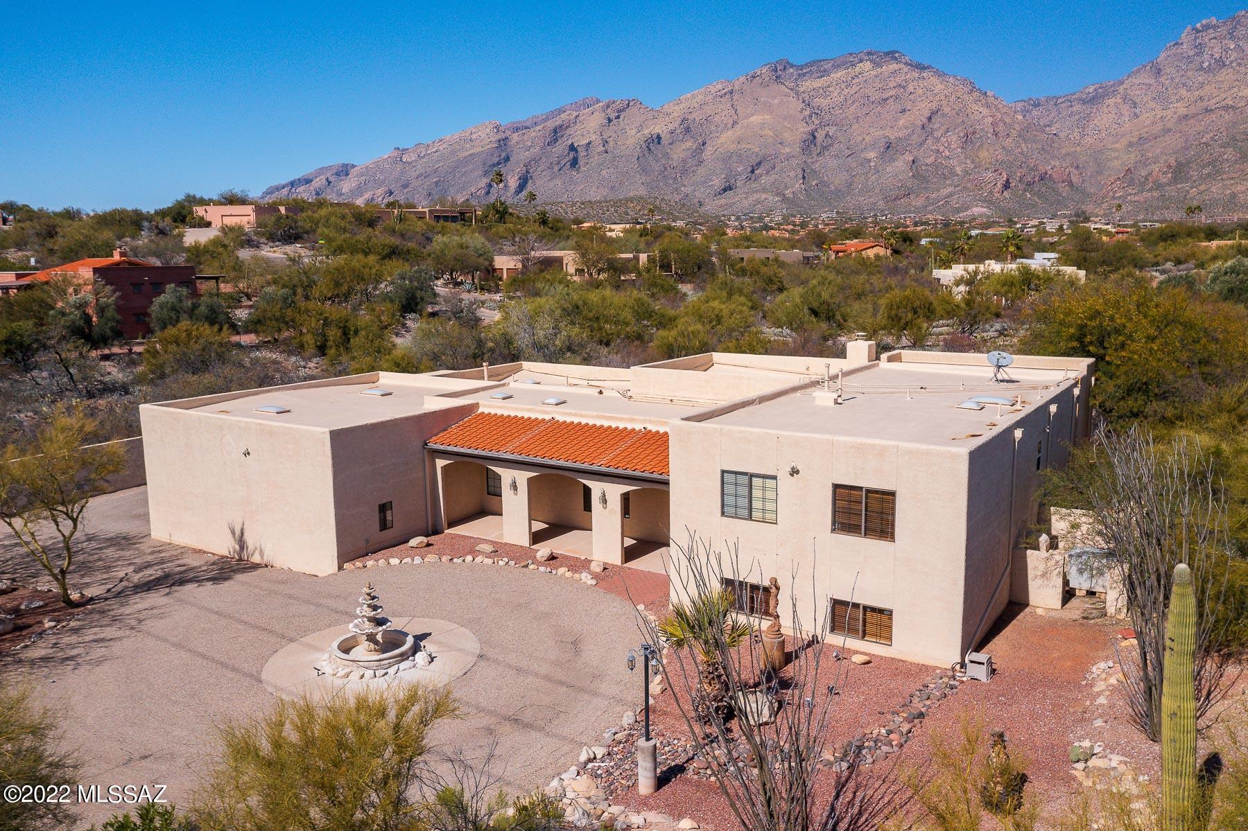 Located perfectly near Kolb and Sunrise, this home allows for privacy AND the convenience of grocery shopping, restaurants and shops within 1 mile. 
Evening walk to El Charro Cafe' or Inca's Peruvian Cuisine would be perfect on our Tucson summer evenings. Lets be honest...we have many beautiful evenings year round.
Ventana Canyon is 2.4 miles from this home. You will be able to enjoy the Flying V Bar and Grill, golfing, hiking and even a waterfall hike! 
This home provides great spaces for entertaining. Large kitchen, pool with a diving board, lower level game room/kids room, gorgeous views... Come take a look at this Foothills home!