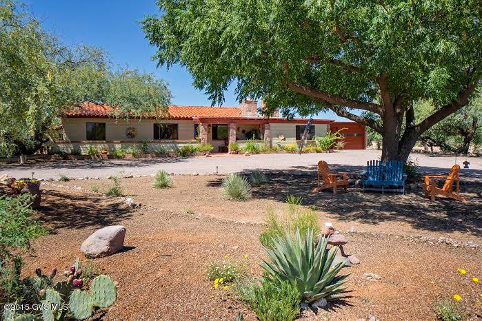Built in 1970 by A.C. Ray, this home has undergone an amazing transformation! Stained concrete floors compliment the original Mexican tile floors that remain in the dining and family rooms. Two master suites, 1 with Kiva fireplace and jetted tub, allow for privacy and there are 2 additional bedrooms and a full bath for guests. Kitchen has newer stainless steel appliances and a view to the pool area. The laundry room is huge - lots of storage and a utility sink. In addition to a workshop behind the cabana, there is an extra storage rm behind the dble garage. The patio/pool area has a built-in barbeque & leads to a great cabana with bar and lots of entertaining space. Roof recoated in June, pool is solar heated w/outdoor shower. Furniture available by SBOS.