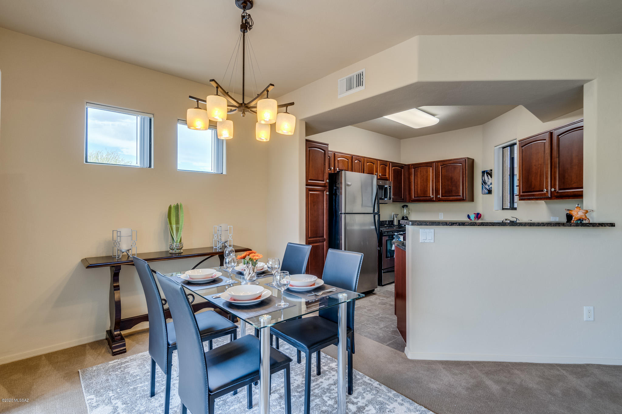 Luxury condo at the highly coveted Rio Del Sol! Furnished unit with fully equipped kitchen, washer & dryer, linens, etc. Contemporary newer furnishing. Designer finishes in kitchen & bathroom, incl. dark wood cabinetry, granite counter tops, stainless-steel appliances. Enjoy the mountain views from your private balcony. Designated covered parking spot; plenty of guest parking available. This exclusive gated community offers resort style amenities incl. 2 Pools & Spas, Gym, outdoor BBQ's & Clubhouse. Superb location; walk to St. Philip's Plaza with Shopping & Restaurants via the private access to the Riverwalk, Close to UofA & Medical Centers. Price is inclusive of all utilities. One of the owners is licensed to sell Real Estate in the state of AZ.