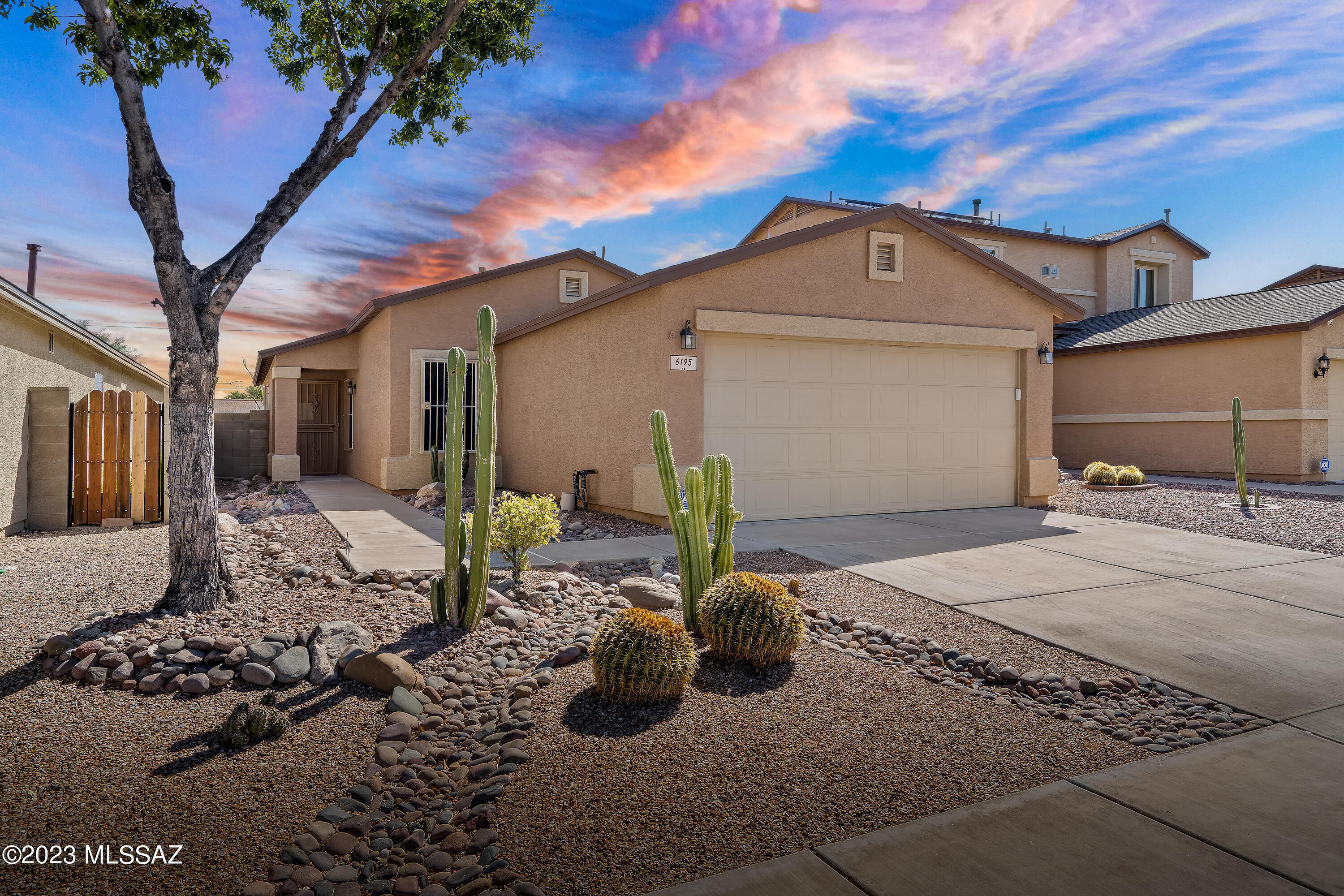Immaculate 3-Bedroom, 2-Bathroom Home with 2-Car Garage, Move-In Ready with Pristine Landscaping. This delightful property features ceramic tile throughout, an open kitchen with a spacious island, and ample cabinets. Conveniently located near Tucson Airport and shopping. Your perfect new home awaits!