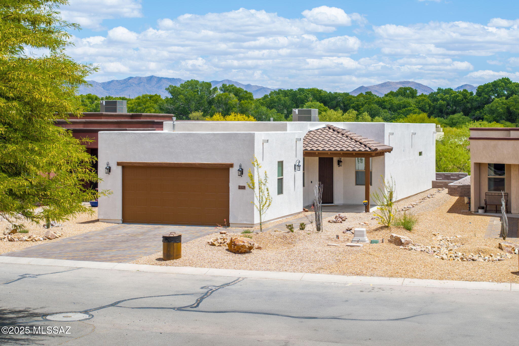This immaculate 3-bedroom, 2-bath home, built in 2024, offers modern living with high-end finishes and thoughtful design. The spacious kitchen features elegant granite countertops, while the open floor plan creates a bright and welcoming atmosphere throughout. Enjoy the mountain views in a beautifully landscaped backyard equipped with an irrigation system, perfect for relaxing or entertaining. The epoxy-coated garage flooring adds durability and a polished touch. Ideally located near community amenities, such as; the gym, pool, and the scenic Juan Bautista de Anza walking trail.