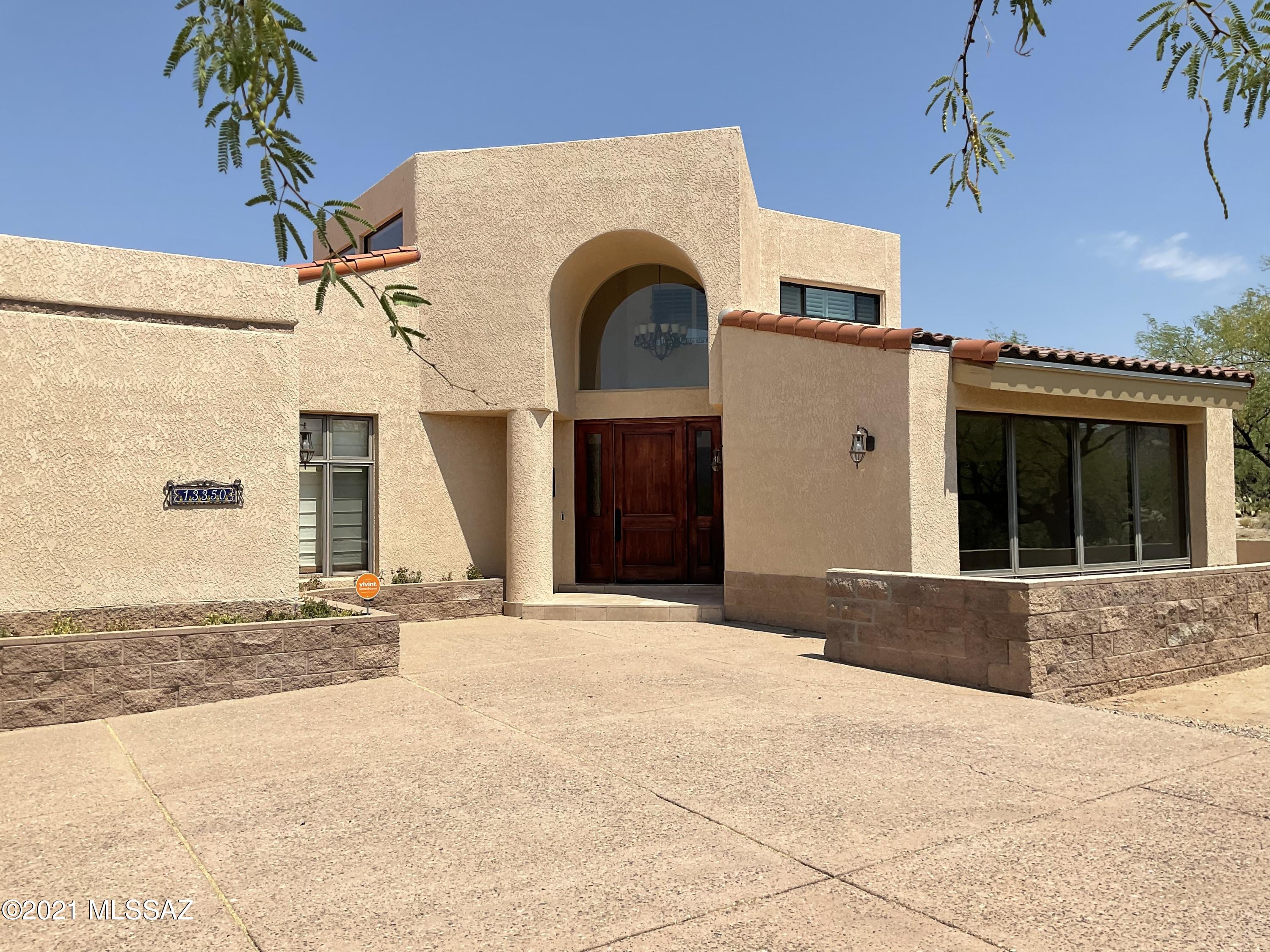 This gorgeous home is located on 3.75
flat acres ideal for horse facilities. Minimal traffic, designated horse trails ,
private lake, access to the TV Wash and Saguaro National Park. Masonry, freshly painted stucco. Inside
features spacious floor plan, high ceilings, huge windows showcasing the Rincon Mtns. Special touches
– Copper chimney fireplace, beautiful wood doors and cabinets, new flooring in several rooms, new
bedroom windows. Gourmet kitchen with abundant Maple cabinetry, granite countertops, SS
appliances, walk-in pantry, bar, wine fridge. Upstairs is the private Master Suite with walk-in closet, jet
tub, separate shower & a balcony . A 3-car garage, lots of storage. Beautifully
landscaped back yard with sparkling pool putting green and a sweeping travertine patio