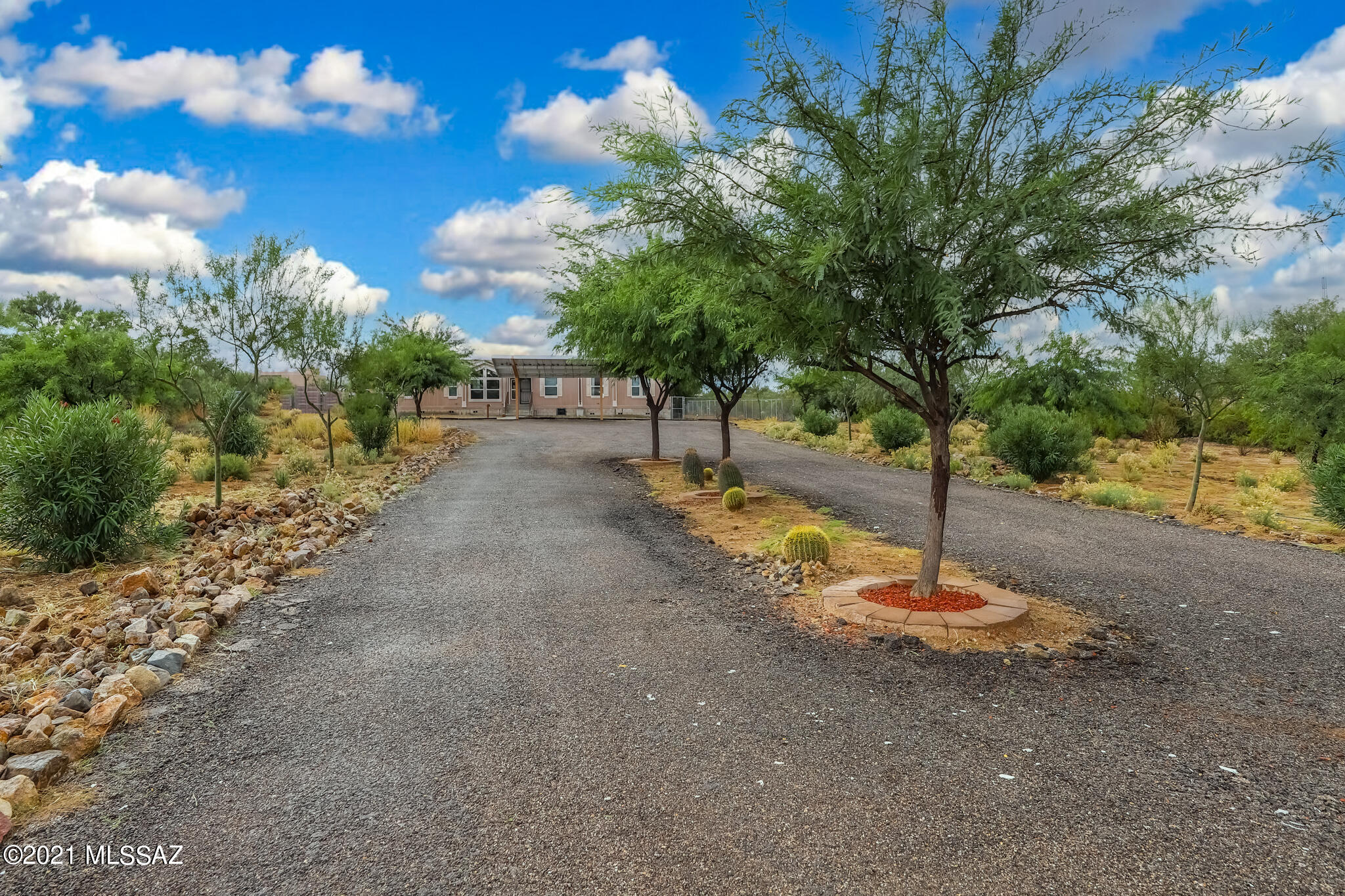 5 acres to call your own! Drive up the beautifully maintained asphalt drive with median bearing desert plantings and trees to your new home. Park under the covered 18 panel owned solar parking and Welcome Home! Located in the highly regarded, award winning Vail School District, this 4 bedroom 2 bath split floorplan home has open, airy feeling and with the very large extra media room, there is plenty of room to live your dream life.  Step off the covered deck into the well-kept, very large, fenced back yard with mature trees, storage, chicken coops and beautiful ''Growing Spaces'' hexagon greenhouse complete with drip, mister and cooling system - grow your own produce!
Home boasts new HVAC July 2021. Your new best life starts here!
Seller to accept/counter offers between 299,000 and 319,0
