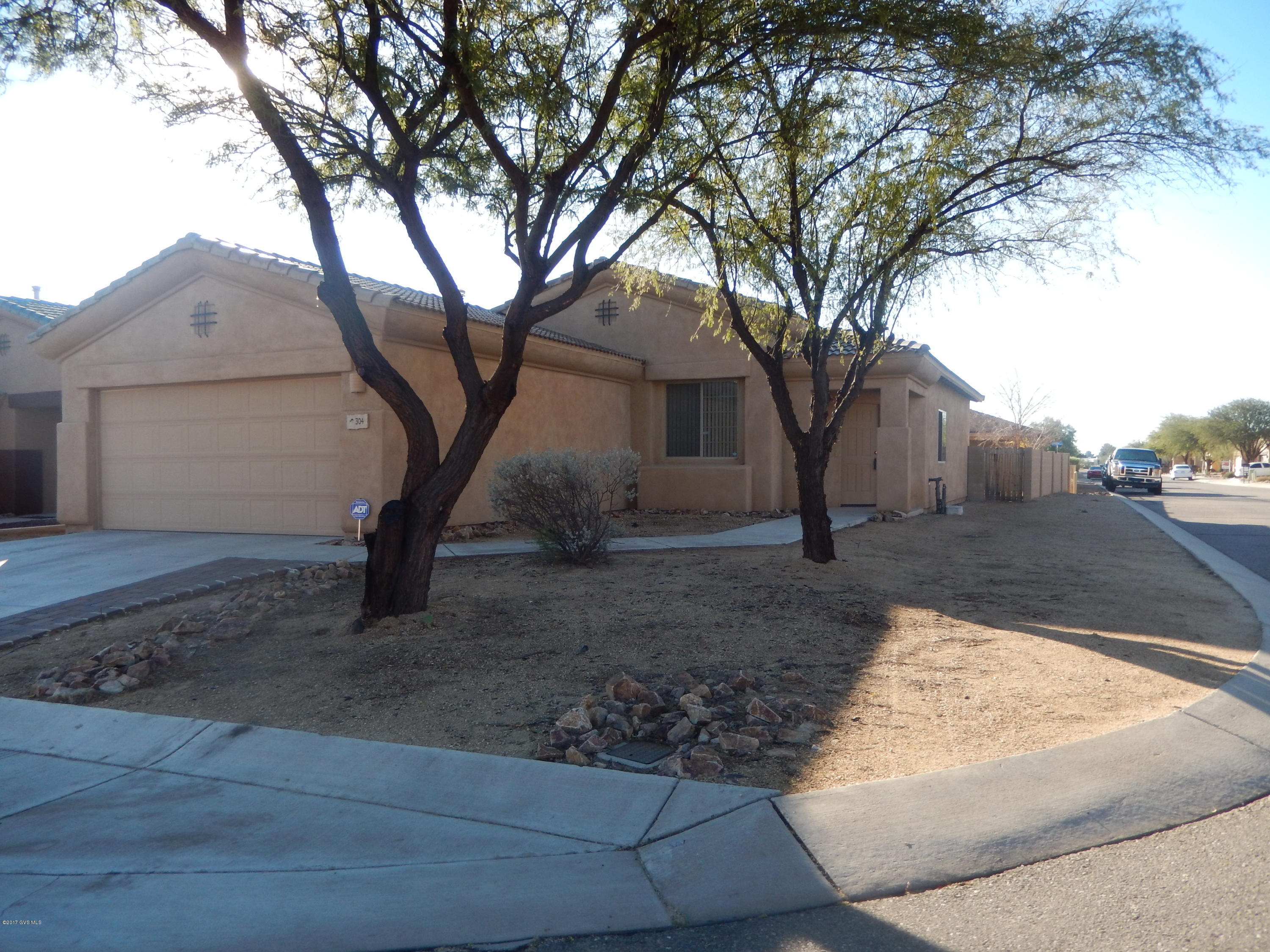 Great family home located on corner lot with large backyard. Beautiful tile floors thruout except carpet in bedrooms. Great room floorplan. Move-in ready condition. Some cabinets in garage and lovely front trees. Community pool.