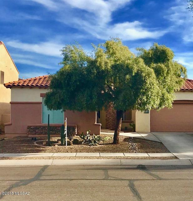 Welcome to this 3 bedroom, 2 bath home located in AWARD winning Rancho Sahuarita‎. This home offers 10 foot ceilings, a formal dining space( could be used for office) Open concept floorplan, eat-in kitchen with Island seating, tile flooring everywhere except 2 bedrooms, SS appliances and washer/dryer convey with the home. Step into your backyard that offers a putting green, mature flowers shrubs, no direct rear neighborhs and a extended patio complete with a fan to keep you cool on those warm summer days. Located 1 block north of the community lake, and very close to the Clubhouse that has the largest private water-park in Southern AZ as well as a mini golf course, tennis courts, a 24 hr fitness center and more. 
Welcome home!