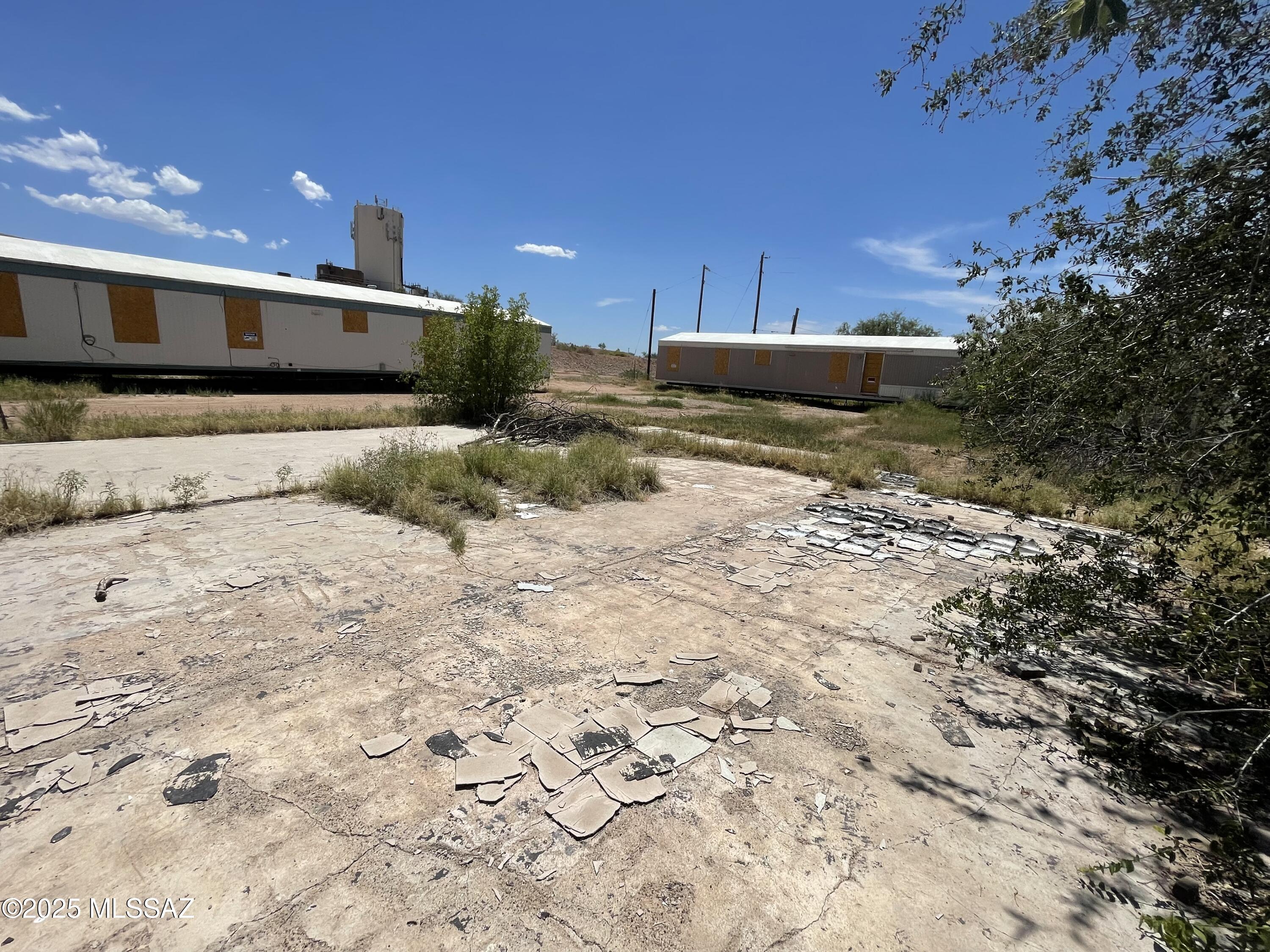 AMAZING INVESTMENT OPPORTUNITY! OWN FOUR CITY LOTS on the end of the street in central Benson. Site built or manufactured homes are ok, and zoning allows for THREE dwelling units. .34 acres with utilities at the property. OWNER WILL CARRY WITH DECENT DOWN PAYMENT. Contact listing agent for details on terms. Mobile homes on property do not convey but can be purchased separately.