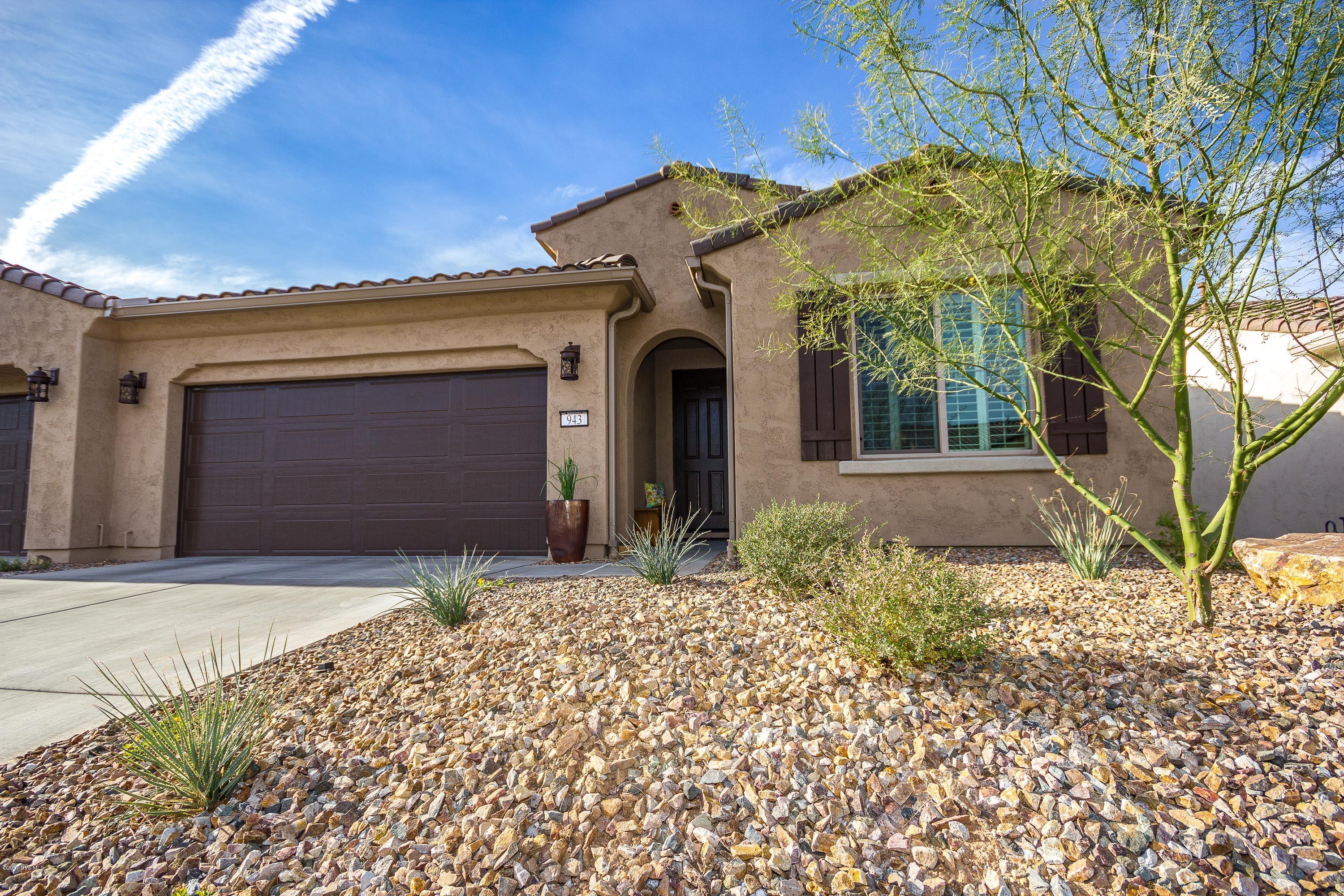 Beautiful Primrose Villa'' on Premium Lot, less than a Year Old. The wide open Mountain & City Views are spectacular and at night you have a sky full of twinkling Stars to admire. This Villa is truly a ''lock and leave'' home, with many custom features! Kitchen upgrades include: Beautiful cabinets & decorator lighting, Granite counters with custom backsplash, Stainless appliances with gas upgrade. This split floor plan has the master and guest bedroom separated by a spacious den for privacy. Upgraded tile and carpet. Master bath has a quartz counter top, custom backsplash & tile shower with a walk in closet and large cabinet for extra storage. Covered patio has a generous paver extension. With the maintenance free exterior this is; Quiet, Peaceful, Secure Resort Style living at its