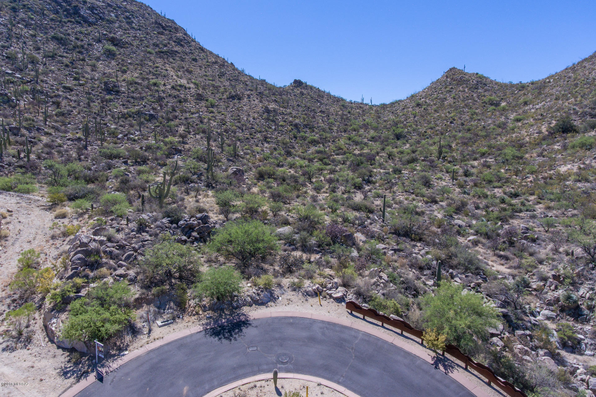 Tranquility in the Tortolita Mountains w/all that Sonoran Desert living has to offer! Countless age-old Saguaros soaring into the sky, unique rock formations & yes-desert wildlife! Located in the guard-gated Canyon Pass Community of Dove Mountain, this private 2.35 acre cul-de-sac lot has a relatively flat building envelope & is located towards the upper end of the canyon which sports breathtaking views of the beautiful canyon & spectacular desert skies! Dove Mountain is home to several golf courses including The Gallery Golf Club & The Golf Club at Dove Mountain at the 5 Star Ritz Carlton Resort (both former homes of the PGA Accenture Match Play). Design your own home or plans are available for separate purchase for a 5,424 sq ft contemporary style home designed just for this lot!