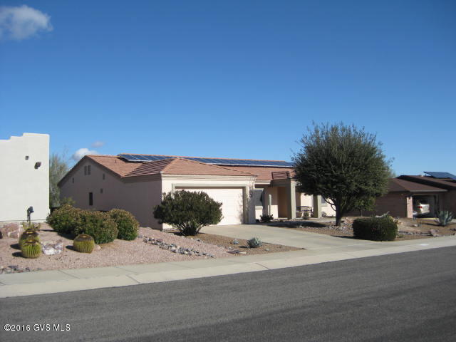 Step through the front door into an elegant and spacious home. Meticulously maintained with two separate bedroom suites, this home has cathedral ceilings, sewing/craft room, an 8x8 storage room in the garage and a very open floor plan. Must be seen to be appreciated. The backyard is a private oasis for relaxing and bird watching with a covered patio and a retractable awning for additional shade. To top it all off there is a 3.4 kw OWNED solar system with very very LOW electrical bills. A short walk from the pool, spa, tennis and exercise room at the Las Campanas GVR center. This is one not to miss!