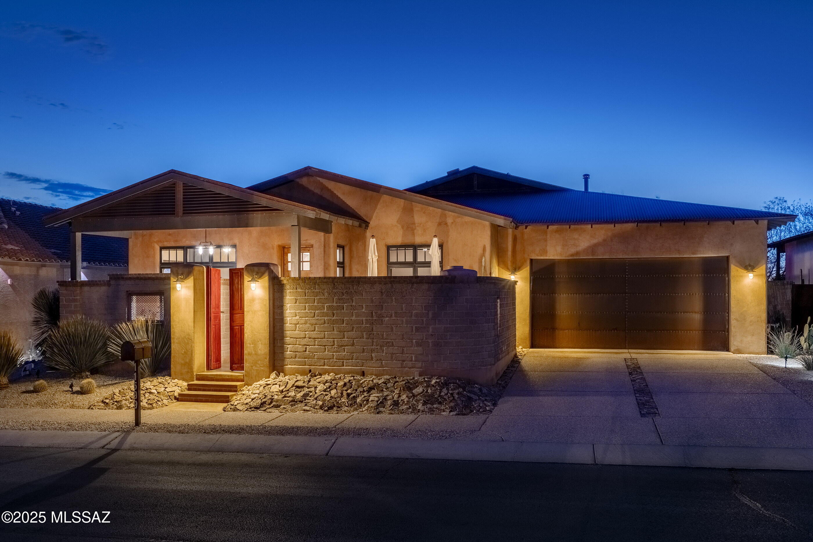 Located in the private, gated community of Sky Ranch, and backing to protected natural open space, this Stellar Gray built home offers breathtaking sunset views and exceptional craftsmanship. The open, bright, and airy 4 bedroom, 3 bathroom floor plan seamlessly blends modern elegance with timeless Southwestern charm. Designed with energy efficiency and durability in mind, this residence features 11-inch thick Rastra (ICF) exterior walls, integral-colored plaster, a 20-gauge rusted metal roof, and Low-E Marvin windows. A beautiful custom wood entry door, 1 3/8'' solid knotty alder interior doors, and maple shaker cabinetry enhance the refined aesthetic, while polished concrete floors and a striking plastered masonry fireplace add warmth and sophistication. The gourmet kitchen is a chef's dream, boasting a custom wood island, granite countertops, upgraded stainless steel appliances, and copper sink. 

Seamlessly integrating indoor and outdoor living, the home opens onto an expansive veranda overlooking the beautifully landscaped backyard. Enjoy the full outdoor kitchen, perfect for entertaining, and refresh under the outdoor shower before dipping into the pool and elevated spa beneath the desert sky.

Ideally situated within close proximity to shopping, fine and casual dining, world-class resorts such as The Ritz-Carlton and The Gallery Golf Club, and an array of outdoor activities, this home offers an unparalleled Southwestern lifestyle. A true architectural masterpiece, where inspired design meets exceptional craftsmanship.