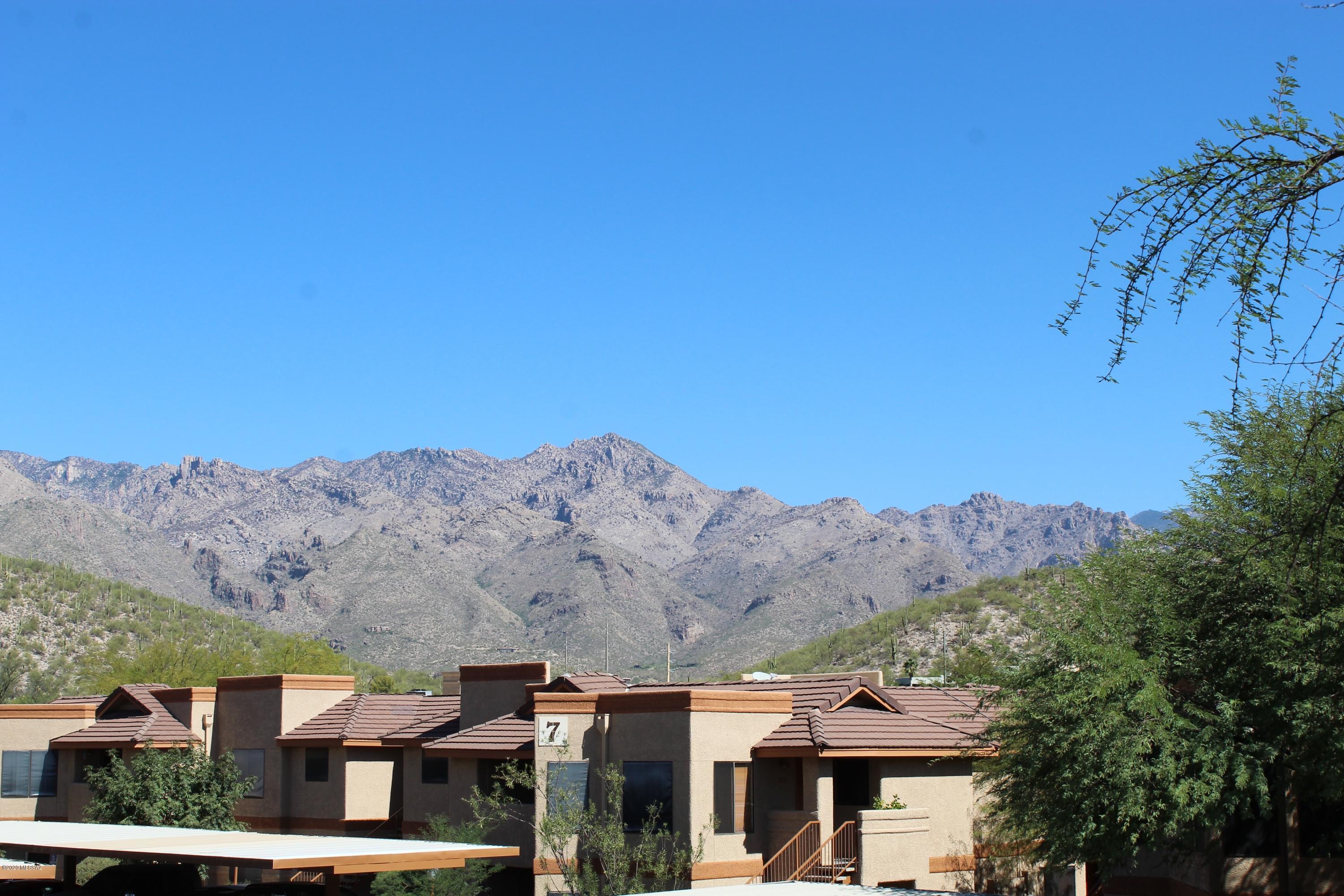 Gated Community! The Villas at Sabino Canyon. Open floor concept light and bright with beautiful mountain views from balcony and dining area.Great location near shopping, hiking, restaurants. Conveniently close to pool and spa amenities.This is a great condo in a beautiful community!