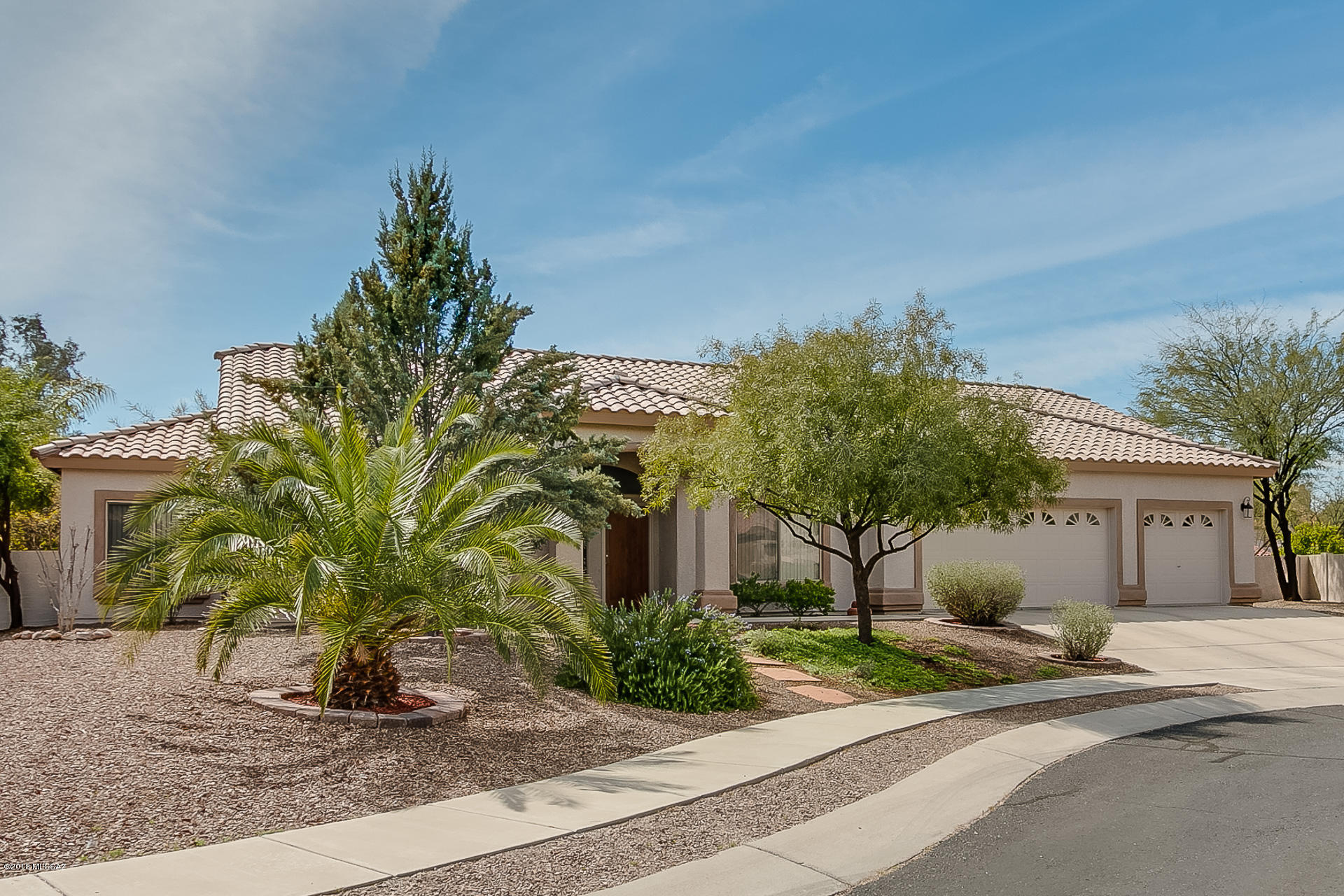 Exceptional 4BD/2BA/3 car garage 2,400sqft home is nestled in a quiet cul-de-sac at La Cholla Estates. Enter this home and you will find a spacious floorplan, large great room with a fireplace. Open concept kitchen with SS appliances & plenty of storage. Great-room with fireplace. Enjoy the spacious master suite and master bath featuring dual sinks, garden tub, walk in shower and large walk in closet. Outdoor living at it's finest. Covered/uncovered patio with citrus trees & turf throughout large backyard. Plenty of room for a pool! This home is in immaculate condition and perfect for the most discerning buyer. A must see.