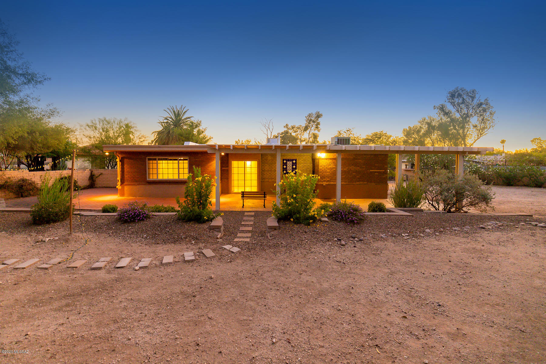 Remodeled Mid-century home in Sam Hugues on  a 15,235 sqft lot!  Room to expand, build a guest house or pool on huge lot.  Gorgeous kitchen with newer cabinets, countertops and appliances.  Large bedrooms and spacious master bedroom with its own bathroom & walk-in closet. Nice, covered patio off kitchen/dinning area.  2 covered parking spaces.  Newer roof.  Dual pane windows.  Enjoy the charm of Sam Hughes and perks of a remodeled house within a cul-de-sac.  Short distance to U of A and restaurants