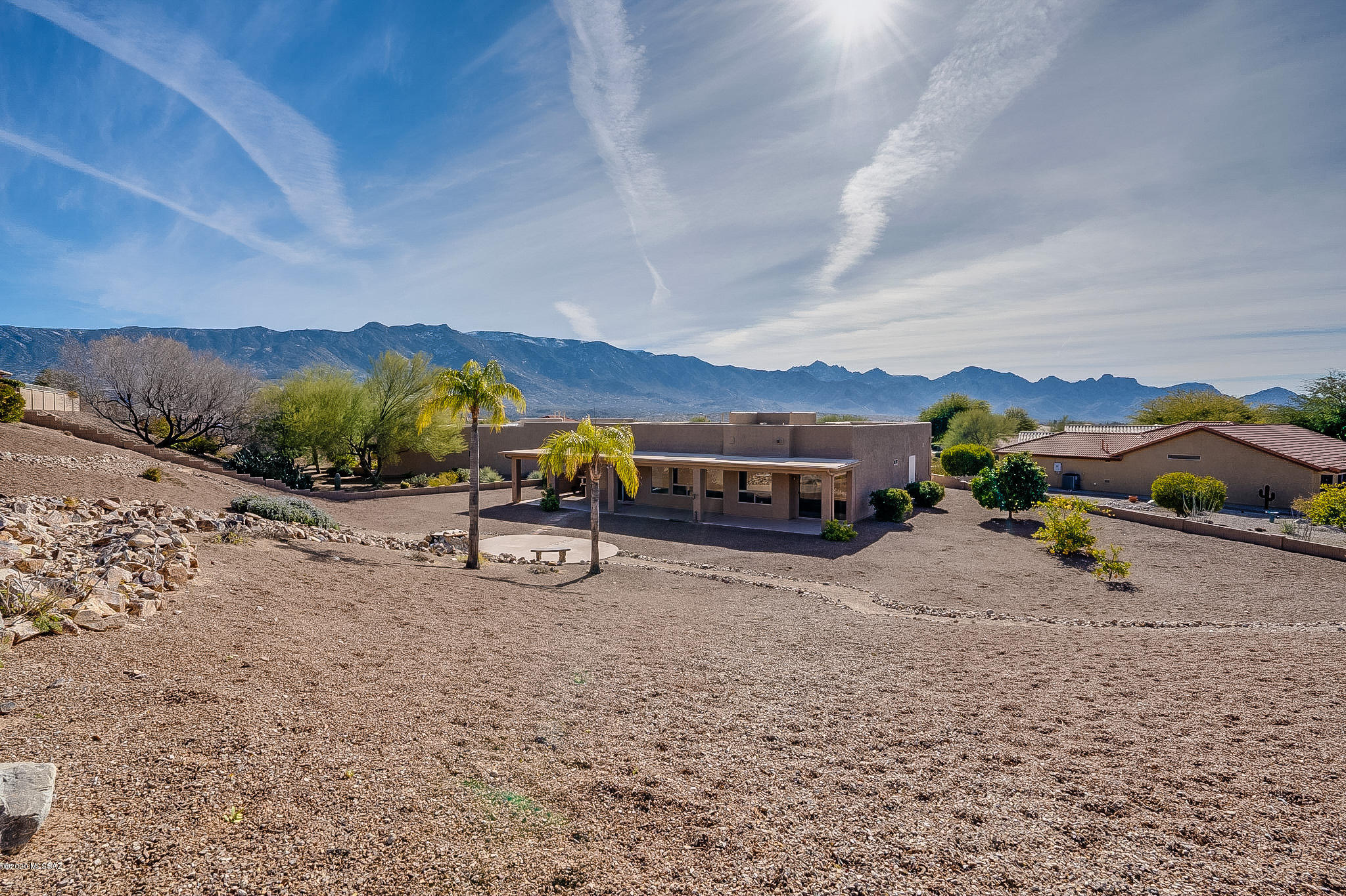 Enjoy the Saddlebrooke lifestyle in this upgraded Santa Fe  Ponderosa w/casita! Located on a quiet cul de sac, the low maintenance lot affords lots of privacy and views of abundant wildlife. Gorgeous mountain views from well placed patio seating areas, citrus trees, rock water feature and epoxy coated covered patio make your backyard a paradise, plus a place to park your golf cart! Inside, hard surface flooring thru out features marble in living areas and travertine in bed/baths. The kitchen features newly refaced cabs w/add'l pantry, new stainless apps & vent hood, quartz counters, tiled backsplash. Master bath is completely remodeled with additional closet, new lighting & mirrors, and tiled shower. Den w/Murphy bed. Casita features tile floor, newer bath w/tile shower & quartz counters.