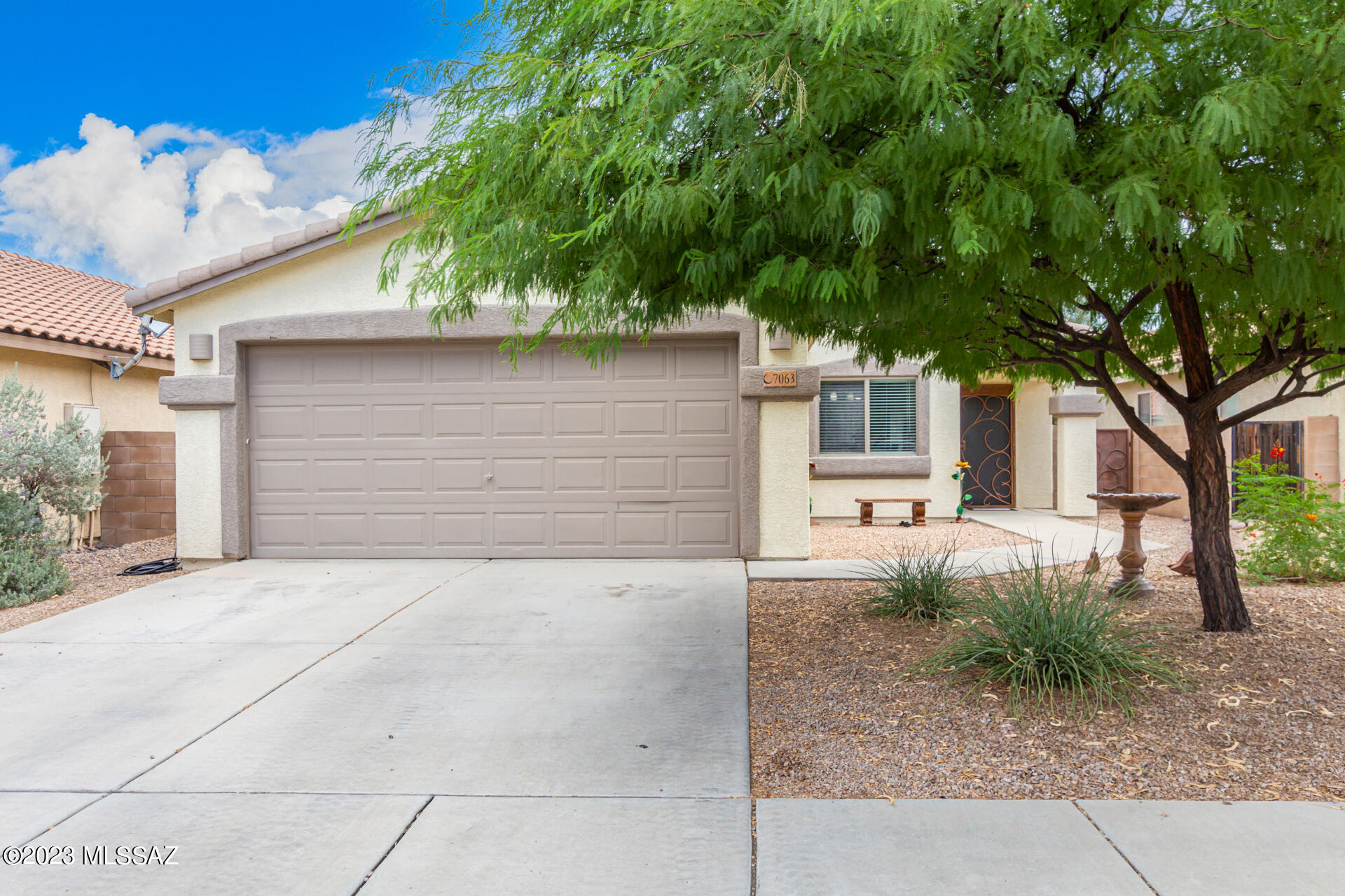 Discover this welcoming 3-bedroom, 2-bathroom home in a desirable neighborhood! Spanning 1,385 square feet, featuring a 2-car garage and a swaying shade tree. Immaculate interior boasts vaulted ceilings, archways, and a well-sized living/dining room with large tile floors, creating a seamless look. The breakfast room is perfect for casual dining! Beautifully remodeled kitchen includes stainless steel appliances, mosaic tile backsplash, ample counter space, and crown moulding cabinetry. Retreat to the main bedroom offering plush carpeting underfoot, a full bathroom w/dual sinks, & a walk-in closet. The hallway bathroom has also been upgraded. The private backyard provides a covered patio, a fire pit, & a dreamy mountain view. Enjoy comfort, style, and community in this charming residence!