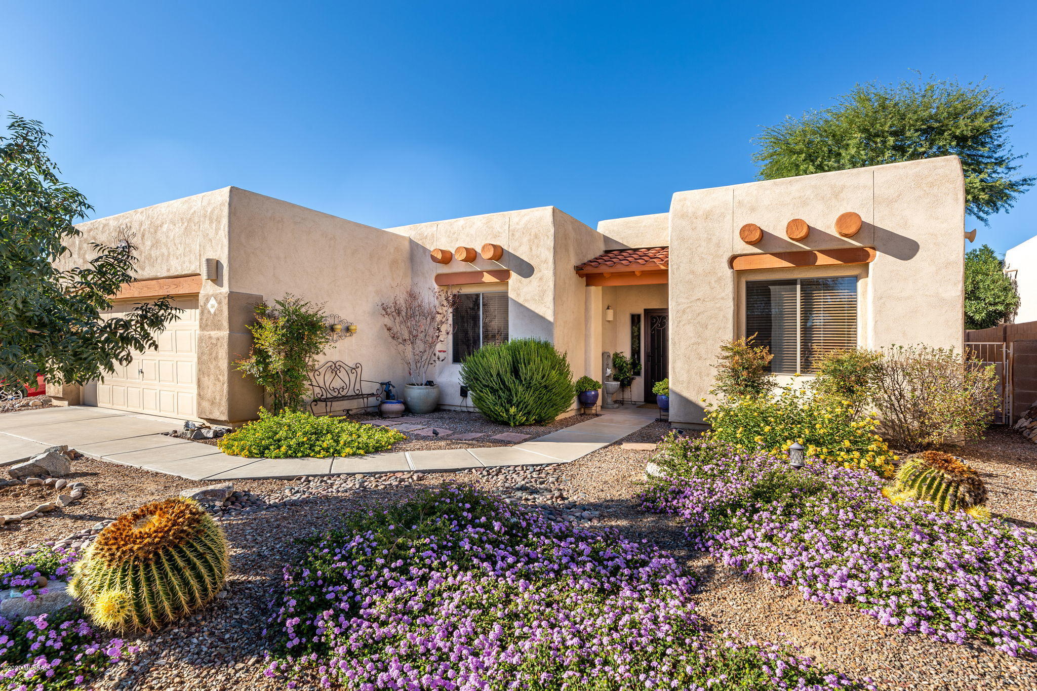 OPEN HOUSE SATURDAY NOV 28, 11 - 3. SUNDAY OPEN HOUSE IS CANCELLED. This super nice well maintained home may remind you a bit of an Italian villa. Nicely located in the heart of Oro Valley, only a couple miles to major shopping, Oro Valley Hospital, hiking in Catalina State Park, many top-notch golf courses, biking trails and so much more. Note the GREAT ROOM, Italian granite counters  and Italian ceramic tile floors, high ceilings, gas stove,  and a spacious 18 X 30 living room. Several skylights, a split bedroom floor plan, and a large foyer welcomes your guests. The north facing back yard, professionally landscaped, extremely private on all  sides. Note the exquisite screened Arizona room. Flagstone pathway with 3 arches &  tuba rose vines - a must see!!  Truly a home to be proud of!