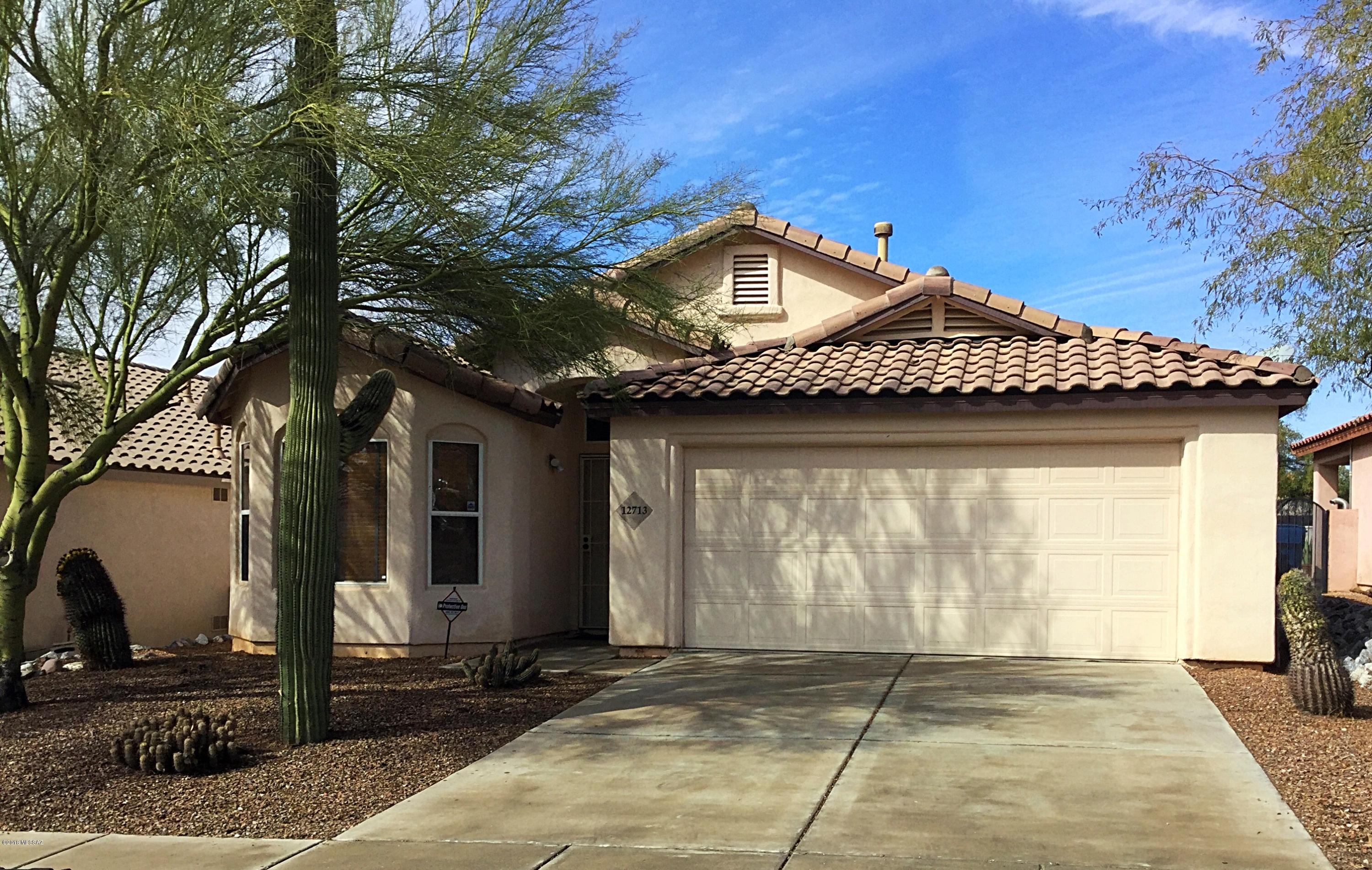 Move in ready!!! Welcoming and beautifully located home in the villages of Dove Mountain, this home features a spacious open floor plan with vaulted ceilings.  Kitchen leads to charming breakfast nook surrounded by windows.  Double door entry to master suite with bay window, double vanity sinks and walk in closet.  Two guest bedrooms separated by hallway and second full bath.  Sliding glass door leads to covered back patio perfect for enjoying the Southern Arizona climate in this comfortable back yard.