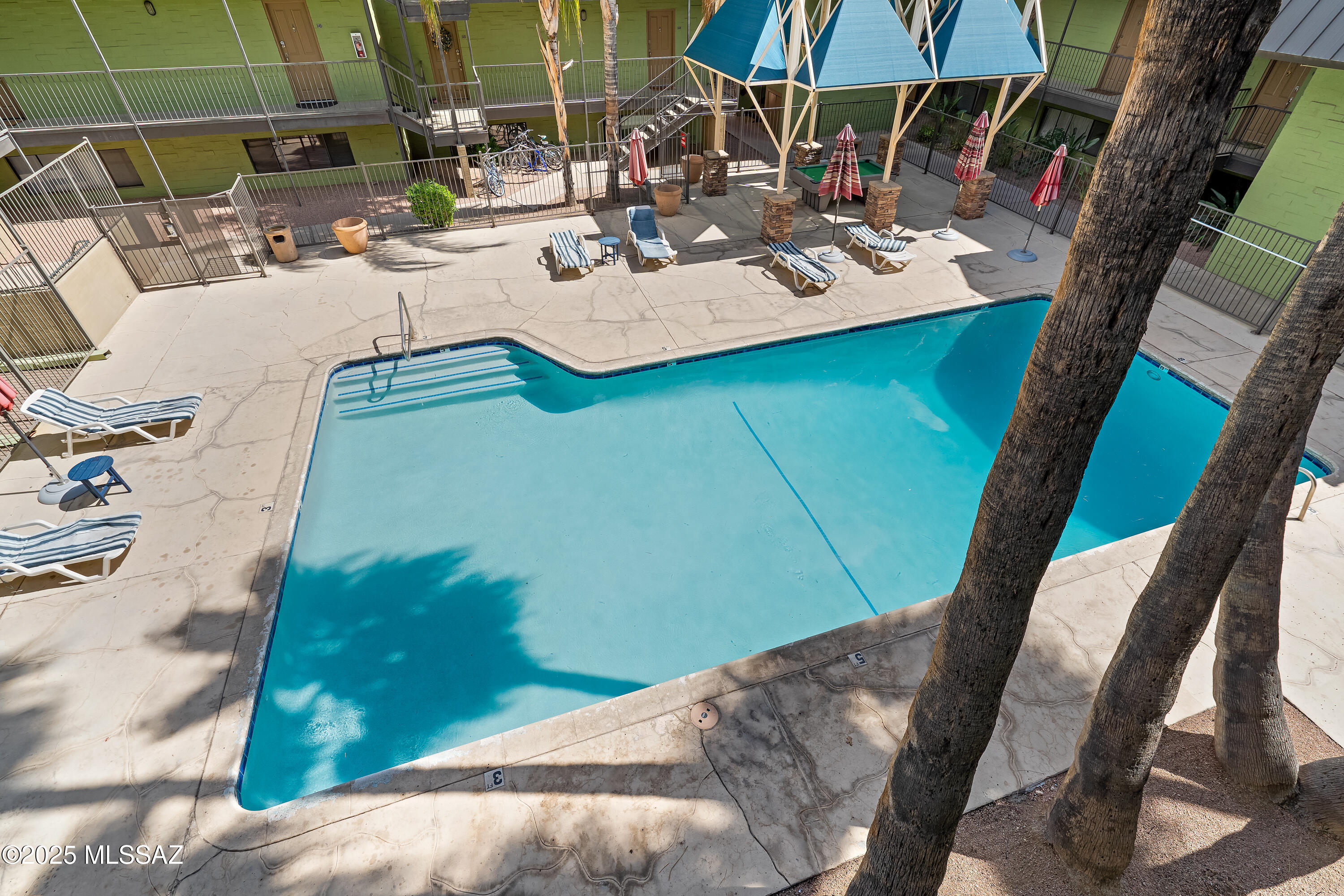 **Turn-key Opportunity** This updated two-bedroom, two-bathroom condo in the Campus Walk community at Costa Del Sol offers a comfortable living space just minutes from the University of Arizona.
The 1,086-square-foot unit features a spacious living room with tile floors, newer carpet, lovely furniture, and a private balcony overlooking the pool.
The kitchen is equipped with black appliances, maple cabinetry and quartz countertops.
Both bedrooms include ample closet space, and the bathrooms have been remodeled with modern fixtures and quartz countertops .
Ideal for students, faculty, or anyone seeking proximity to the university, this condo combines convenience and comfort.
All furniture conveys, and assigned parking spot is located next to a gated, secure entrance.