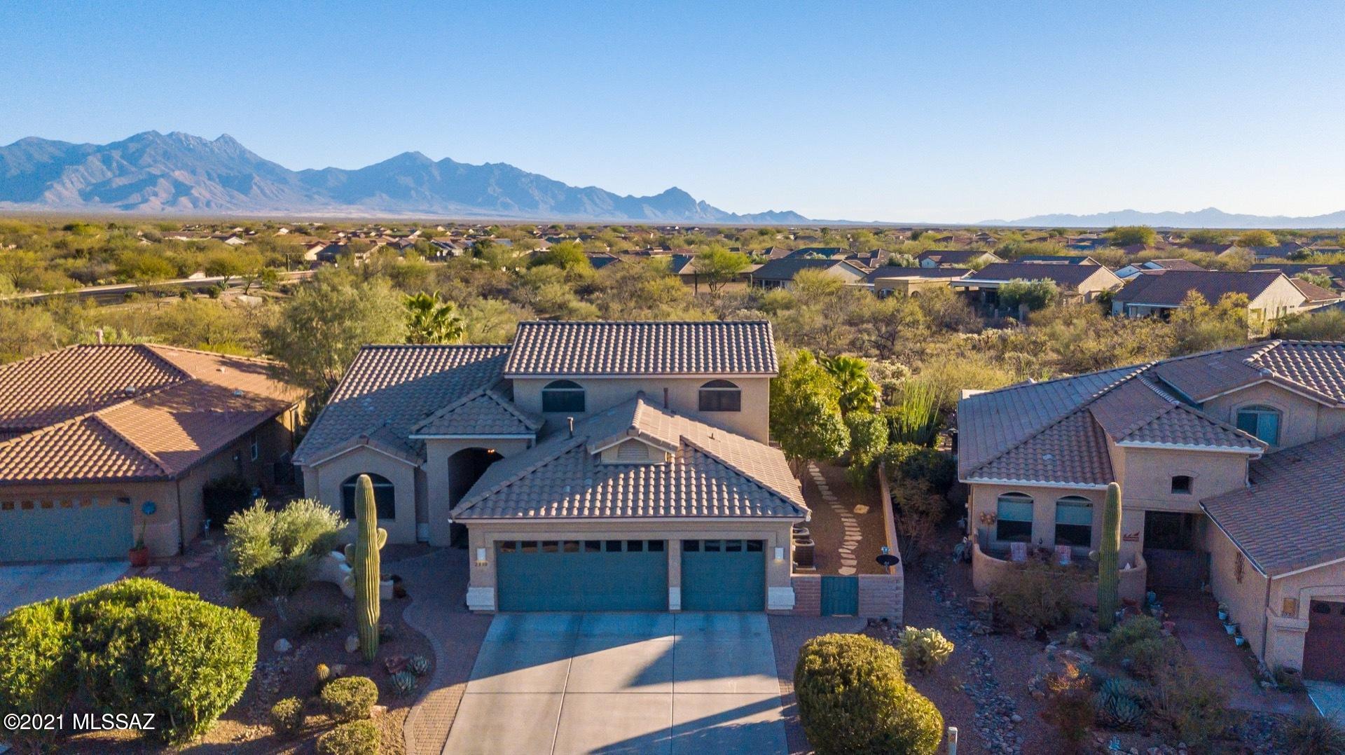There aren't many views and backyards like this one! This is your very own private oasis in the desert! Complete with a pebble-tec self-cleaning heated pool, waterfall, outdoor bar & grill, fireplace and sound system throughout, you'll feel like you are staying at a resort! We call this home the one with the ''upstairs casita''! Yes, upstairs there are 2 bedrooms and a bath for your guests! Downstairs, a huge master suite, family room off the kitchen and separate living/dining area. As you enter the foyer, to the right are double doors that lead into the office/den. The current owners used it as a ''mother-in-law'' bedroom and it now serves the purpose of a storage room until they move! The ''WOW'' factor of this amazing property is the outdoor space! Yet, inside it is equally impressive! The kitchen is huge with expansive "Silestone" countertops, lots of cabinets, a huge one level island, wall oven, microwave and induction cooktop (pots heat up but surface does not!) Within the past two years, there has been a new roof, interior paint, carpet, a new hot water heater, water softener, air conditioning system, irrigation system and even a new epoxy garage floor! The pool filter was replaced as were the pool pump and pool lighting. A water filtration system for drinking water was installed. The tile and grout throughout the home was cleaned in 01/21. This is your dream home! Don't delay!