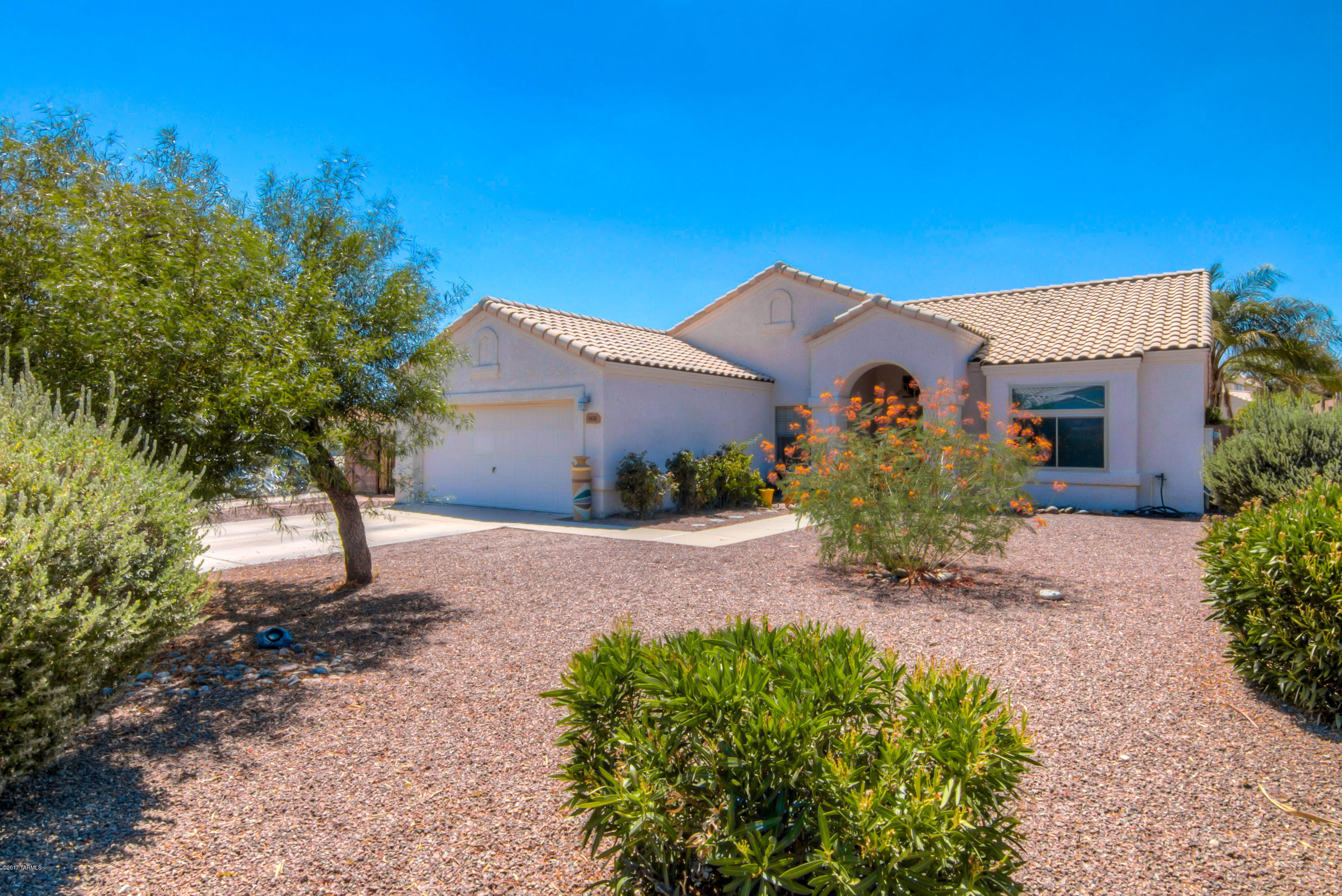 Rare find! Steal stud & block construction home. A 4 bed/ 2 bath home with vaulted ceilings, large rooms and tile roof on a corner lot.  Big back yard, swimming pool with elevated spa new variable energy efficient pump.  Walk in closet and garden tub in master and so much more! Newer AC and hot water heater.  Garage shelving included! Located walking distance to school for a growing family. Or just enjoy a walk around the beautiful neighborhood with your dog.