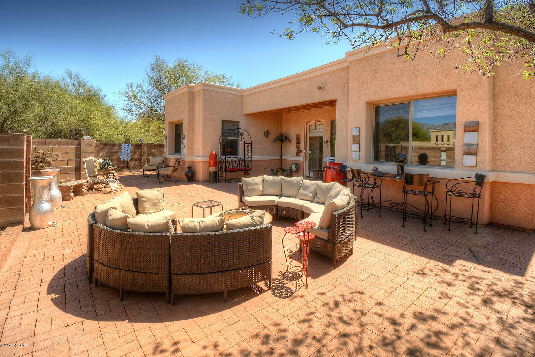 Beautiful contemporary home in Colonia Verde. High ceilings, large great room, spacious kitchen, split floorplan & formal dining room.  This home is perfect for entertaining with the door opening to your courtyard. Large courtyard has brick pavers, a tall block wall for privacy & great mountain views.  Master suite has jetted tub, walk in shower & large closet.  Ceiling fans throughout, tile flooring & new kitchen counters. Enter through an exclusive private drive to your oversized garage.  You'll love this home!