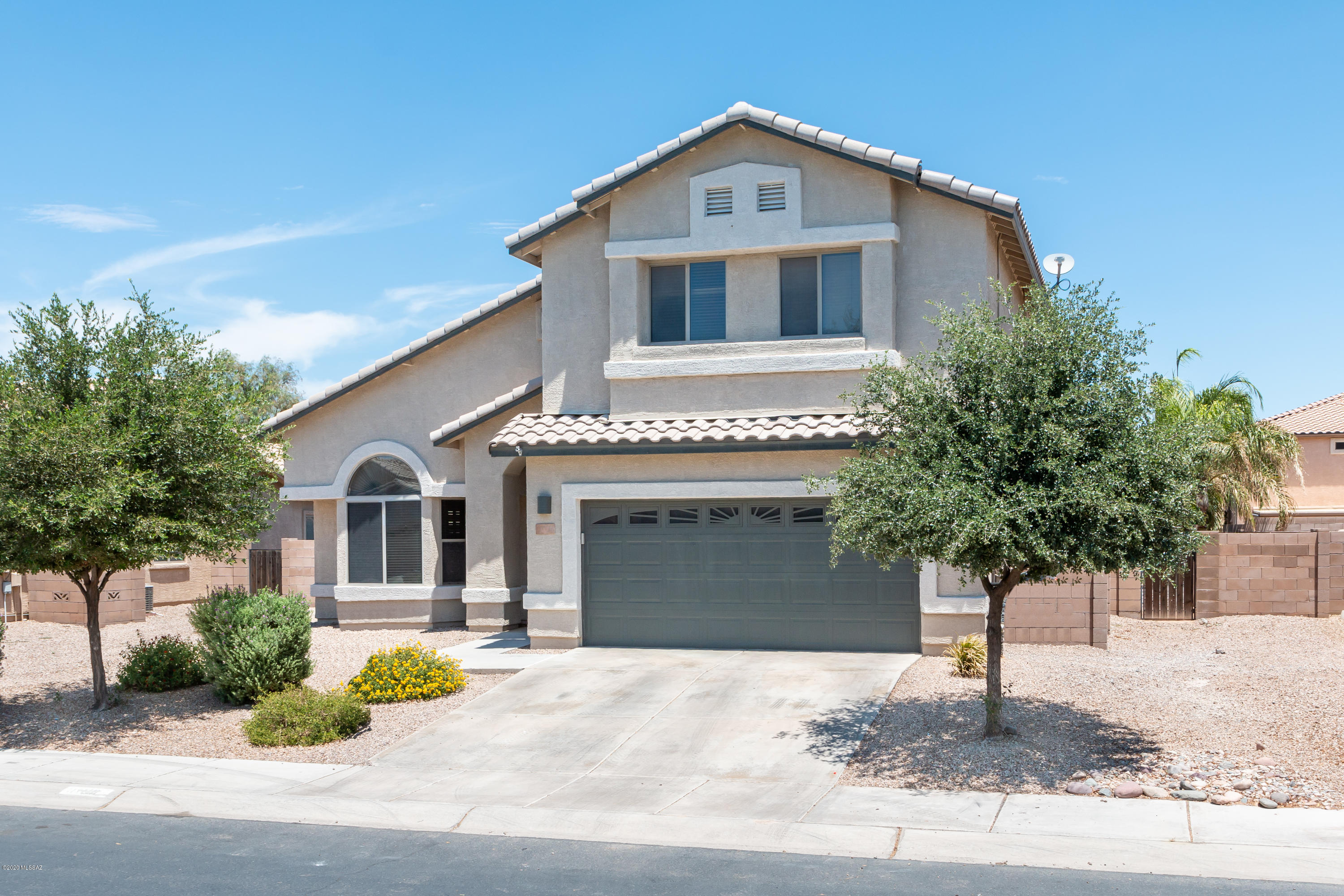 WOW, WOW, WOW! This beautifully UPDATED home has it all! The updated white kitchen has GRANITE counters, stainless steel FARM SINK and appliances, TILE back splash and a walk-in PANTRY. The MASTER bedroom RETREAT has a dual sink vanity, his and hers WALK-IN closets and expanded tiled shower. The BACKYARD is a true resort style oasis, Jump right into your sparkling POOL or relax in the screened in covered PATIO area. A large shaded RAMDADA and gathering area is ready for a BBQ and fun. This open concept floor plan has 4 bedrooms with a potential 5th bedroom downstairs. The HIGH CEILINGS make the home feel open and airy. SOLAR panels also keep
the utility bills lower. Come take a tour of this MOVE-IN ready home today!