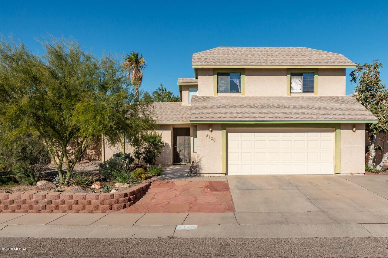Beautiful home in Northwest Tucson, only 3 blocks from Mt. View High School. This immaculate home features; cozy brick fireplace in living room. Eat in kitchen with gas range. Split floor plan, master bedroom downstairs. Master features; large walk in closet & double vanity. Vaulted ceiling & plant shelves make this home live large. Dual cooling. Beautiful grassy backyard & nice garden. Home will not disappoint.