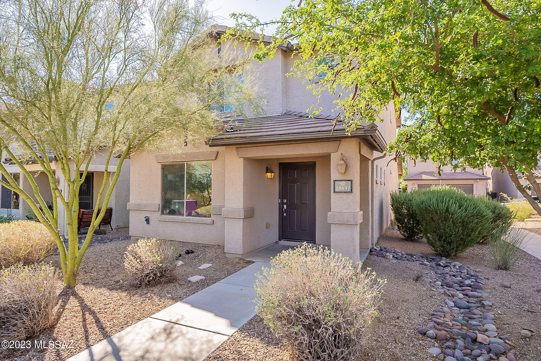 Welcome to your dream desert oasis nestled in the picturesque Sonoran Desert, this stunning 3-bed, 2.5-bath home offers a tranquil escape with modern comforts. You'll be greeted by an open and spacious floor plan with well-appointed kitchen features like ample countertop space, and a breakfast bar, making it a chef's delight. Step outside to peaceful lush landscaping, and breathtaking mountain views. Perfect setting for enjoying a quiet evening under the stars. Primary bedroom suite boasts a walk-in closet and an ensuite bathroom with a tub and separate shower. Two additional bedrooms offer flexibility for guests or a home office. The Community offers amenities like walking, jogging and biking trails, pools, basketball courts, clubhouse & playground. Come fall in love with your dream home