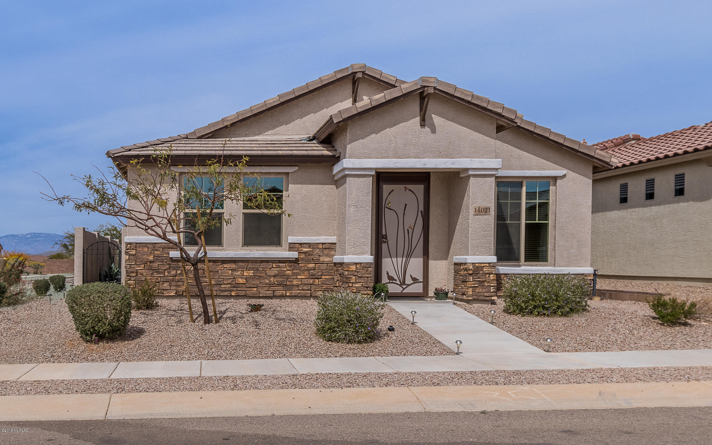 Beautiful SE Contemporary home in the highly acclaimed Del Webb 55+ Active Retirement Community! This single level home host two - 4 panel sliding glass doors that lead to the covered & cobblestone private courtyard. With only one neighbor this home sits next to a common area and extra parking is right out the back door. Enjoy 9' ceilings, 8' doors, Oak Craft staggered cabinetry, water softener, Granite counter & upgraded back splash in the kitchen & both baths. Tile in all but two bedrooms- Stainless Steel Appliances & washer & dryer remain with this home purchase. Maintenance free courtyard arbor- Northern mountain views in this Pulte 2015 built model called ''The Bliss''. Del Webb offers a world of activities that include Pickle Ball, Clubs, Crafts, Exercise Classes and state of the art workout equipment, pool, spa, outdoor covered patio & kitchen, ballroom, group excursions to shows & events, social gatherings, and the security of a Gated Community.
