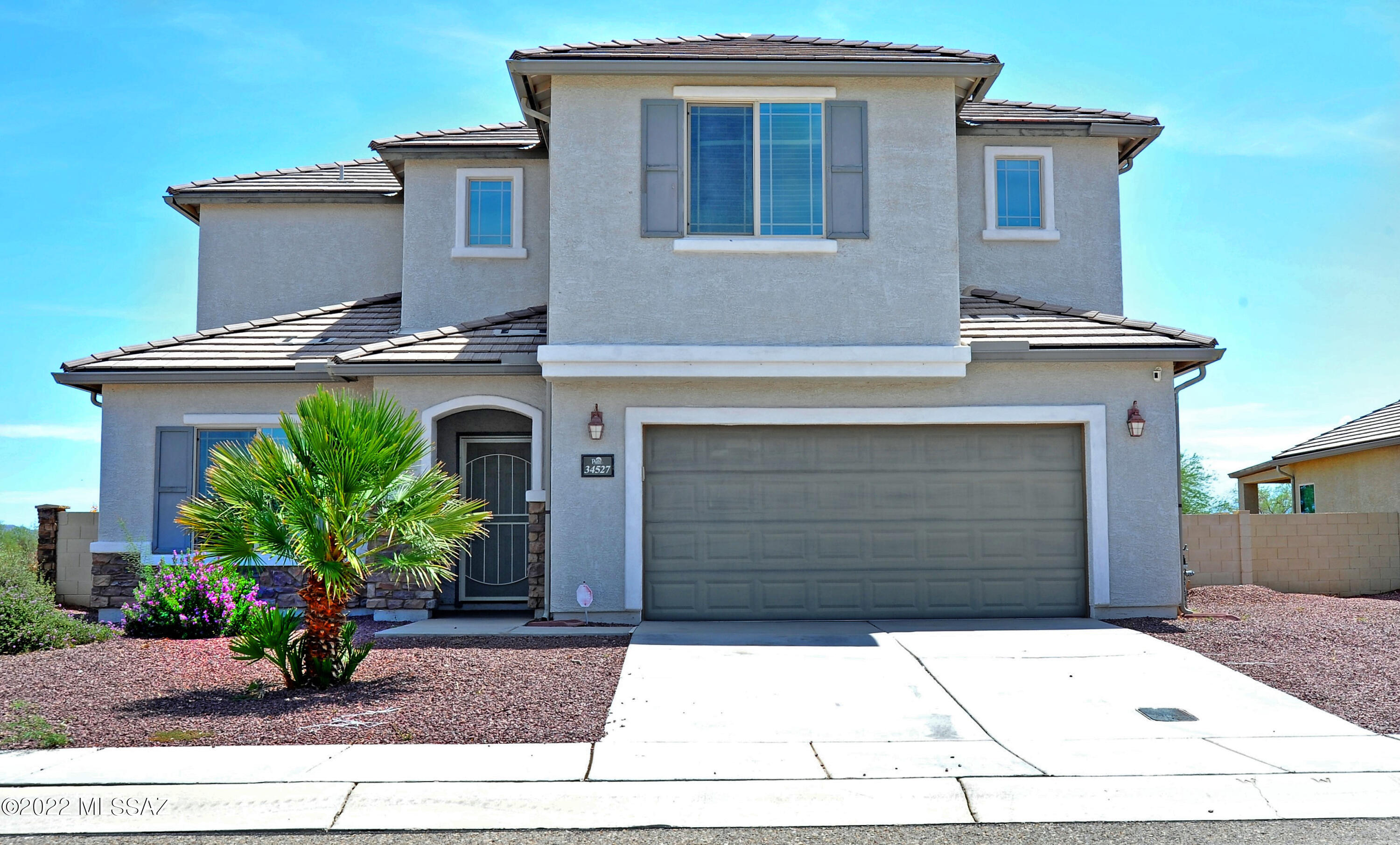 Situated on a huge corner lot, this large home provides ample living AND backyard space, and features a downstairs bedroom with en-suite bathroom - great for a multi-generational family, second primary bedroom, or a private workspace! Located near the I-10, this home's location is ideal to travel to Phoenix or Tucson. Whether you're a daily commuter, avid traveler, or simply just want some space away from the city center, this is your next home!
