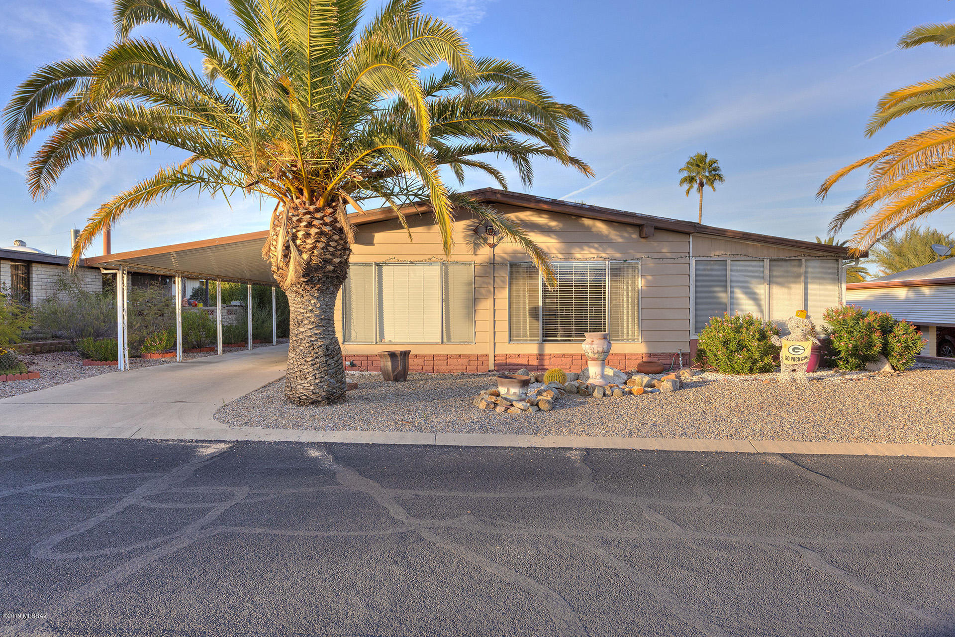 Lovely 2-Bedroom/2-Bathroom open floor plan in Pueblo Estates.  Large screen porch, workshop, and shed on the east side. 2-Car tandem carport on the west side.  Enjoy all the amenities that Pueblo Estates has to offer.  And GVR is available, too.